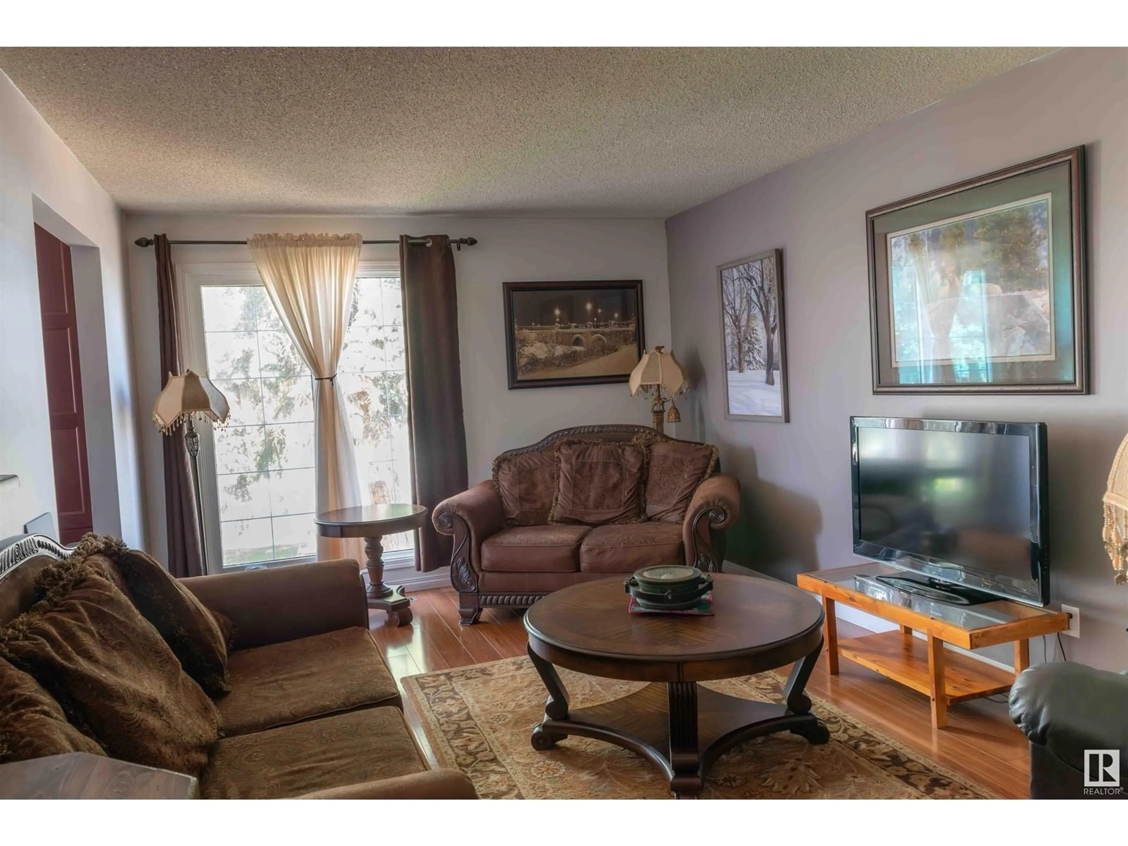 Living room with furniture, unknown for 5207 52 ST, Leduc Alberta T9E5L9