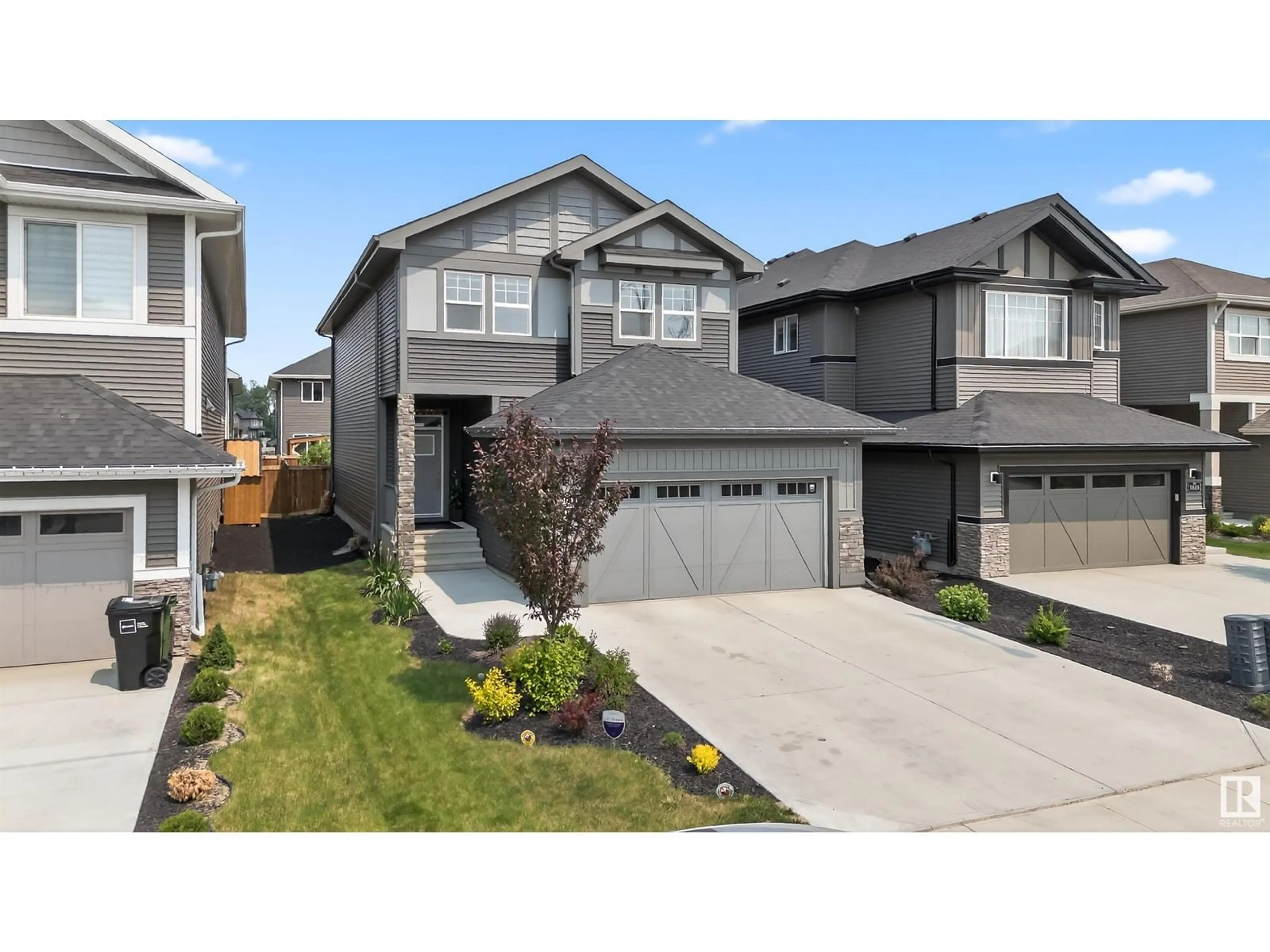 Home with vinyl exterior material, street for 1614 ENRIGHT WY, Edmonton Alberta T6M0Z3