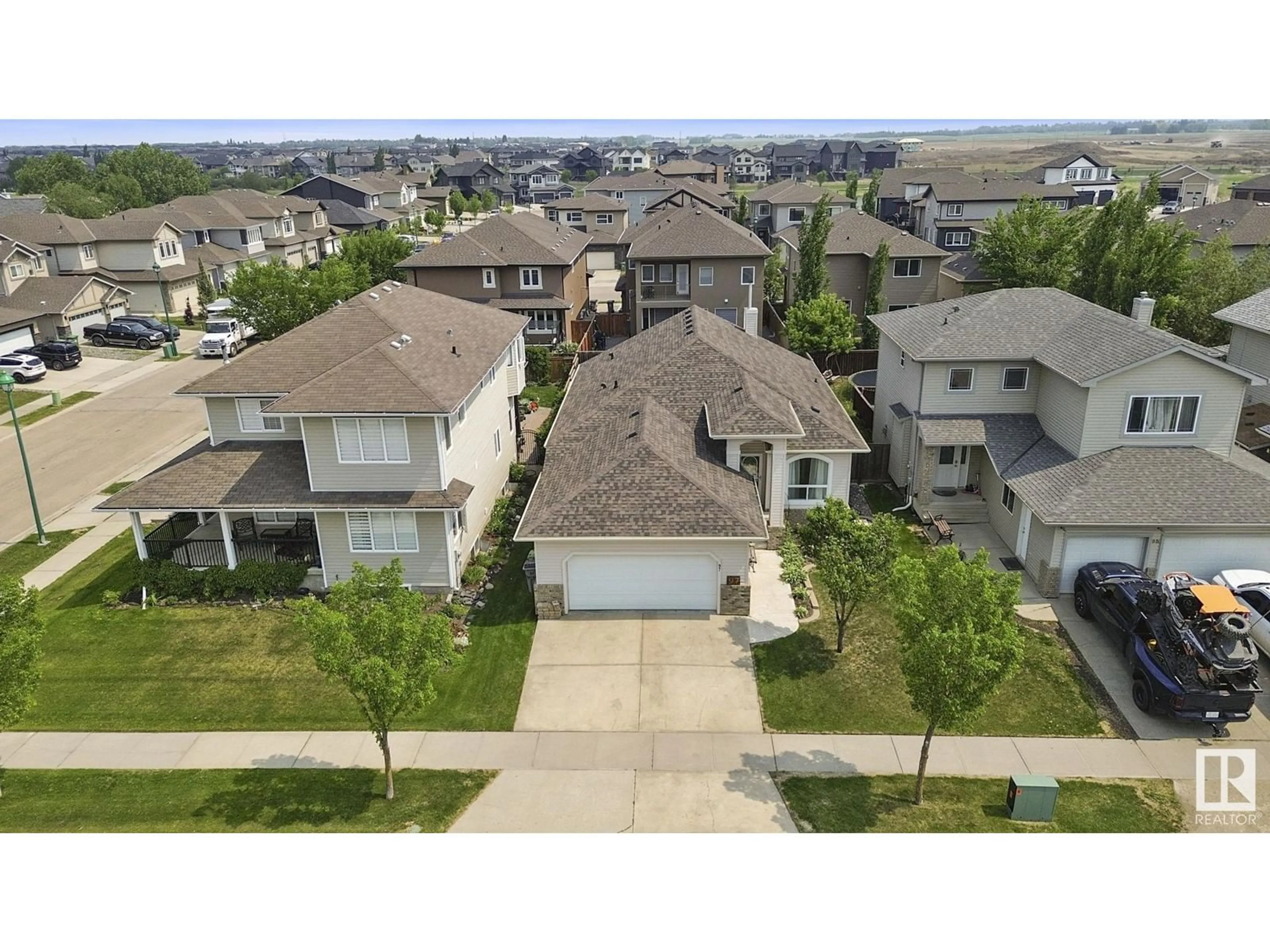 A pic from outside/outdoor area/front of a property/back of a property/a pic from drone, street for 97 LAKEWOOD BV, Beaumont Alberta T4X1T3