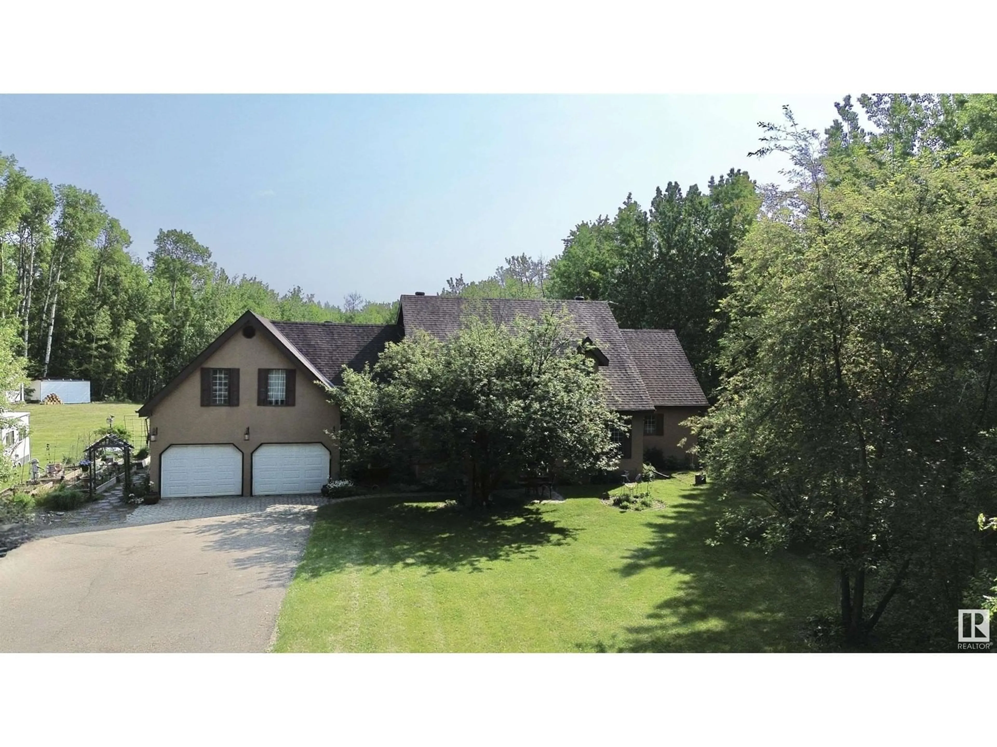 A pic from outside/outdoor area/front of a property/back of a property/a pic from drone, mountain view for 8002 45 ST, Rural Wetaskiwin County Alberta T0C2C0