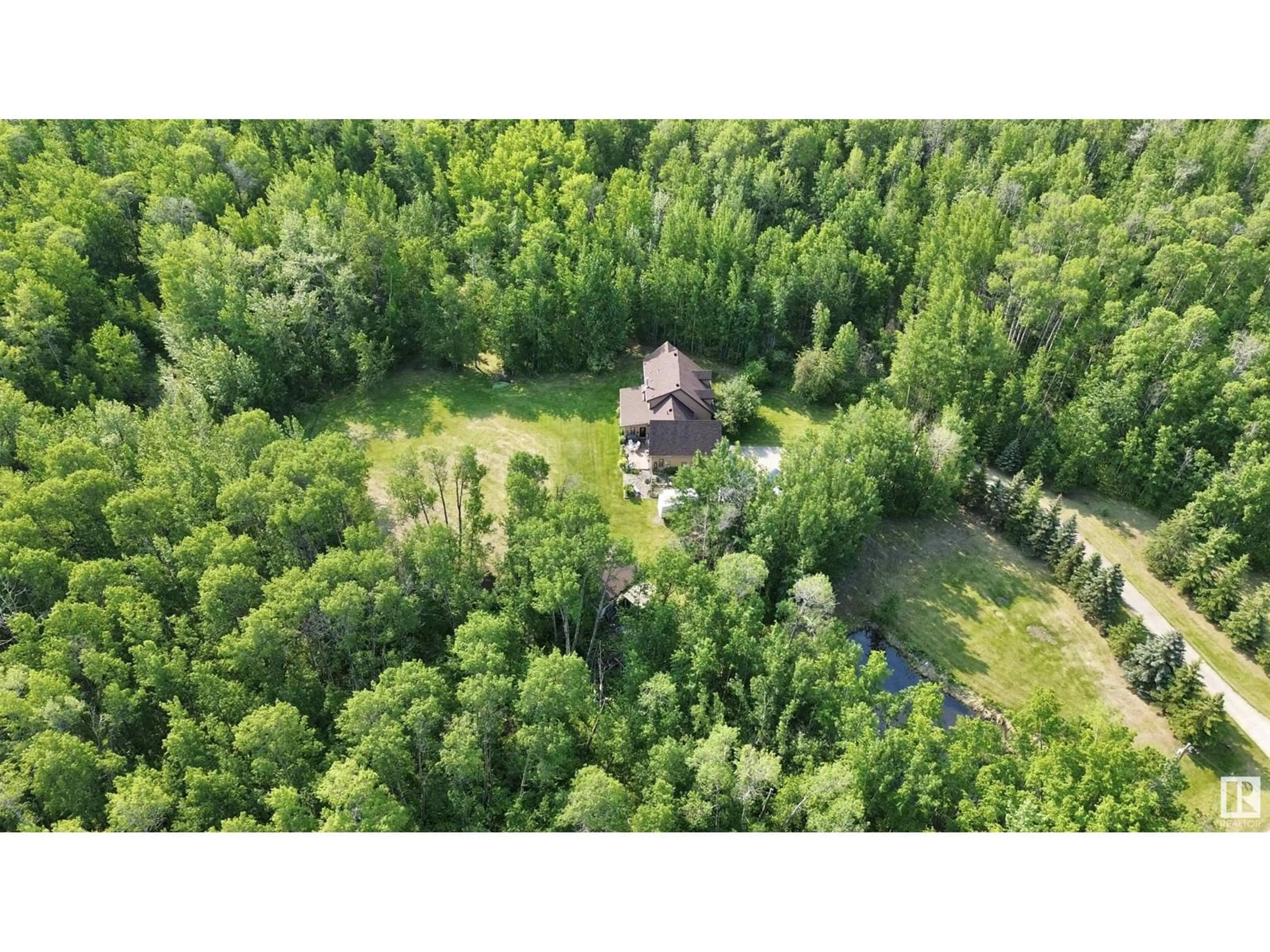 A pic from outside/outdoor area/front of a property/back of a property/a pic from drone, forest/trees view for 8002 45 ST, Rural Wetaskiwin County Alberta T0C2C0