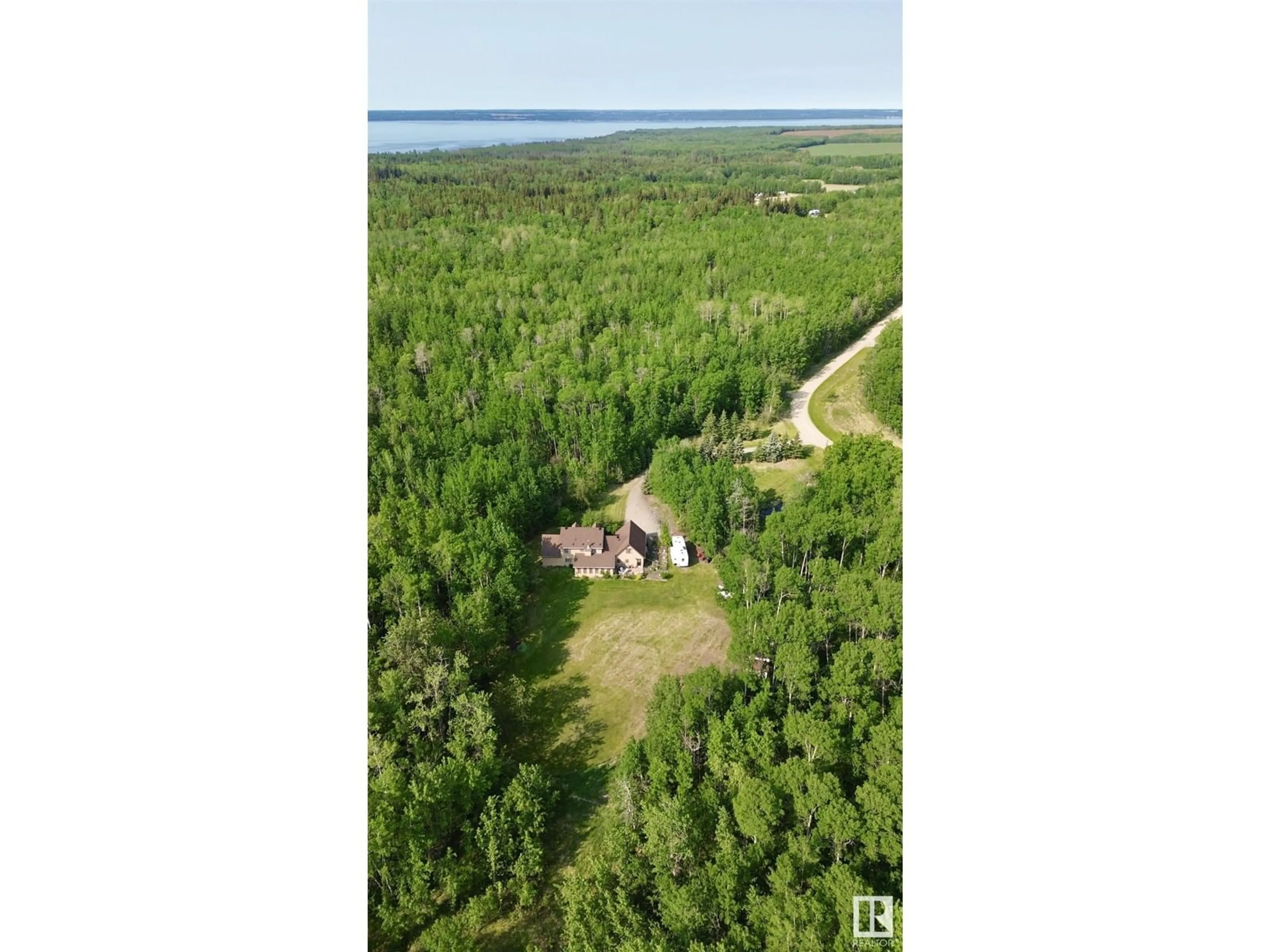 A pic from outside/outdoor area/front of a property/back of a property/a pic from drone, water/lake/river/ocean view for 8002 45 ST, Rural Wetaskiwin County Alberta T0C2C0