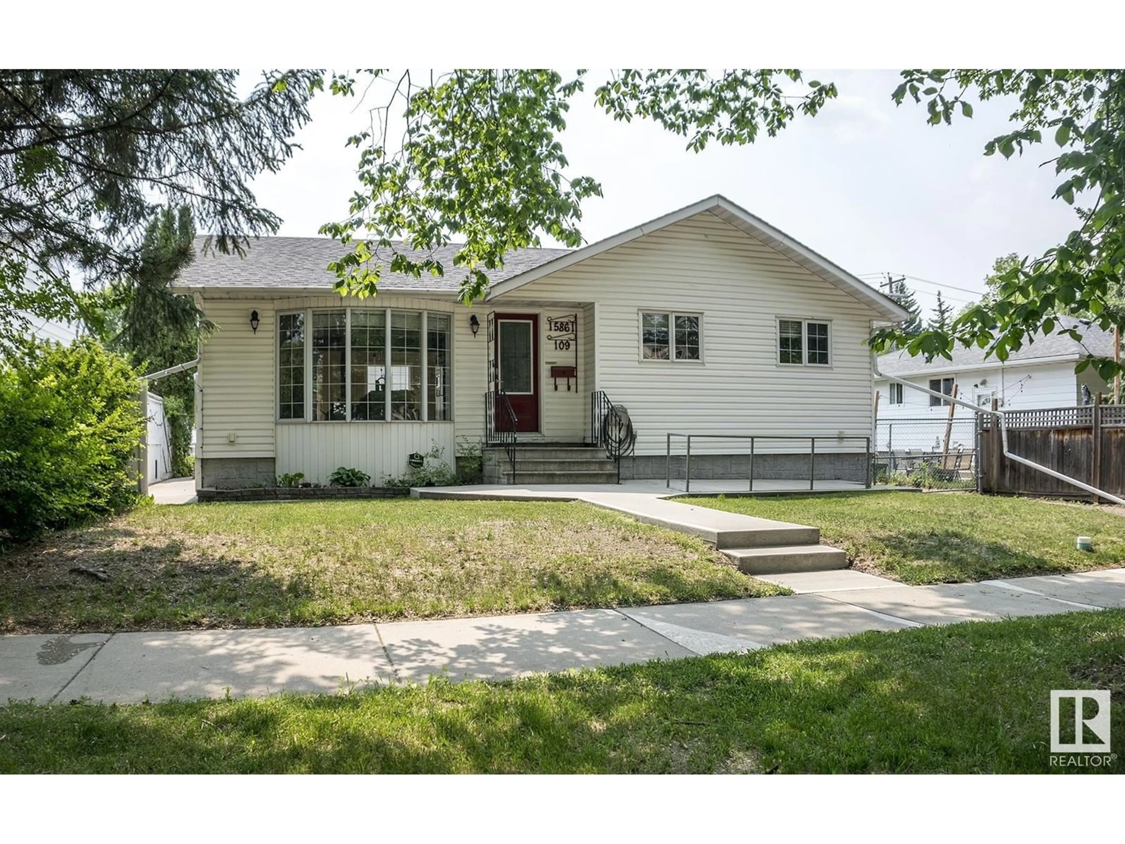 Home with vinyl exterior material, street for NW - 15861 109 AV, Edmonton Alberta T5P1B5