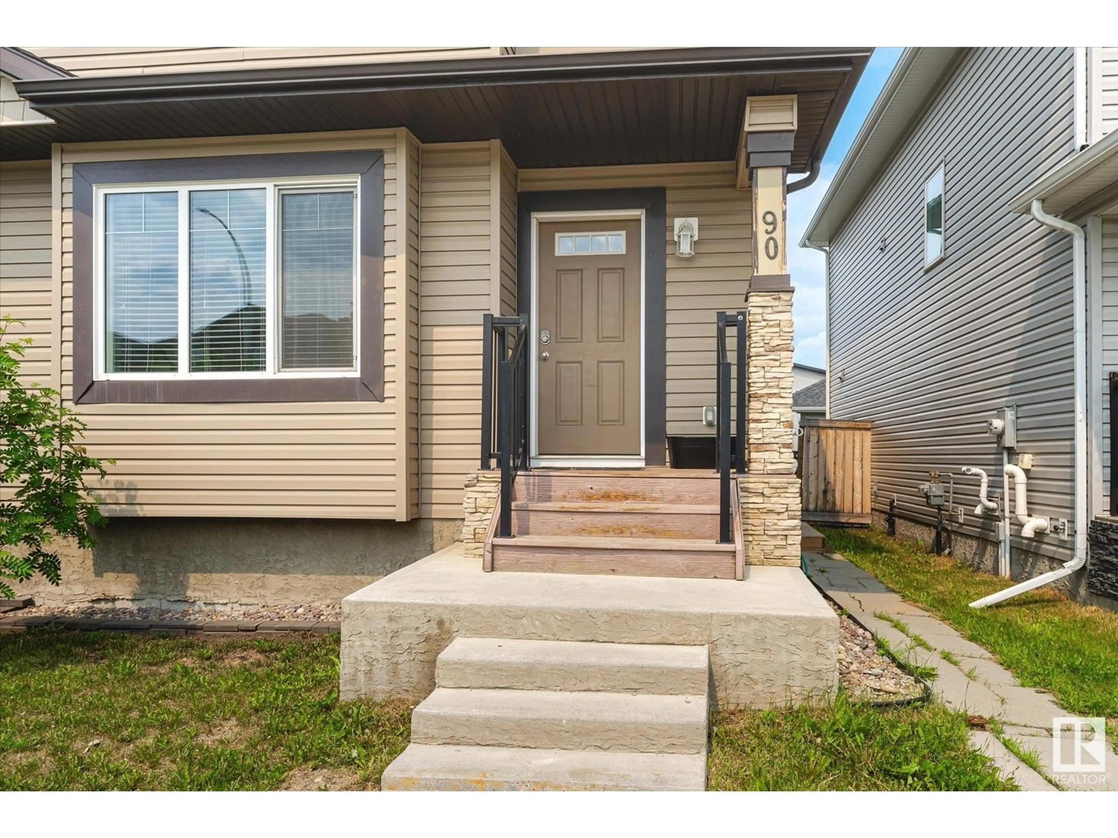 Home with vinyl exterior material, street for 90 RICHMOND LI, Fort Saskatchewan Alberta T8L0S5