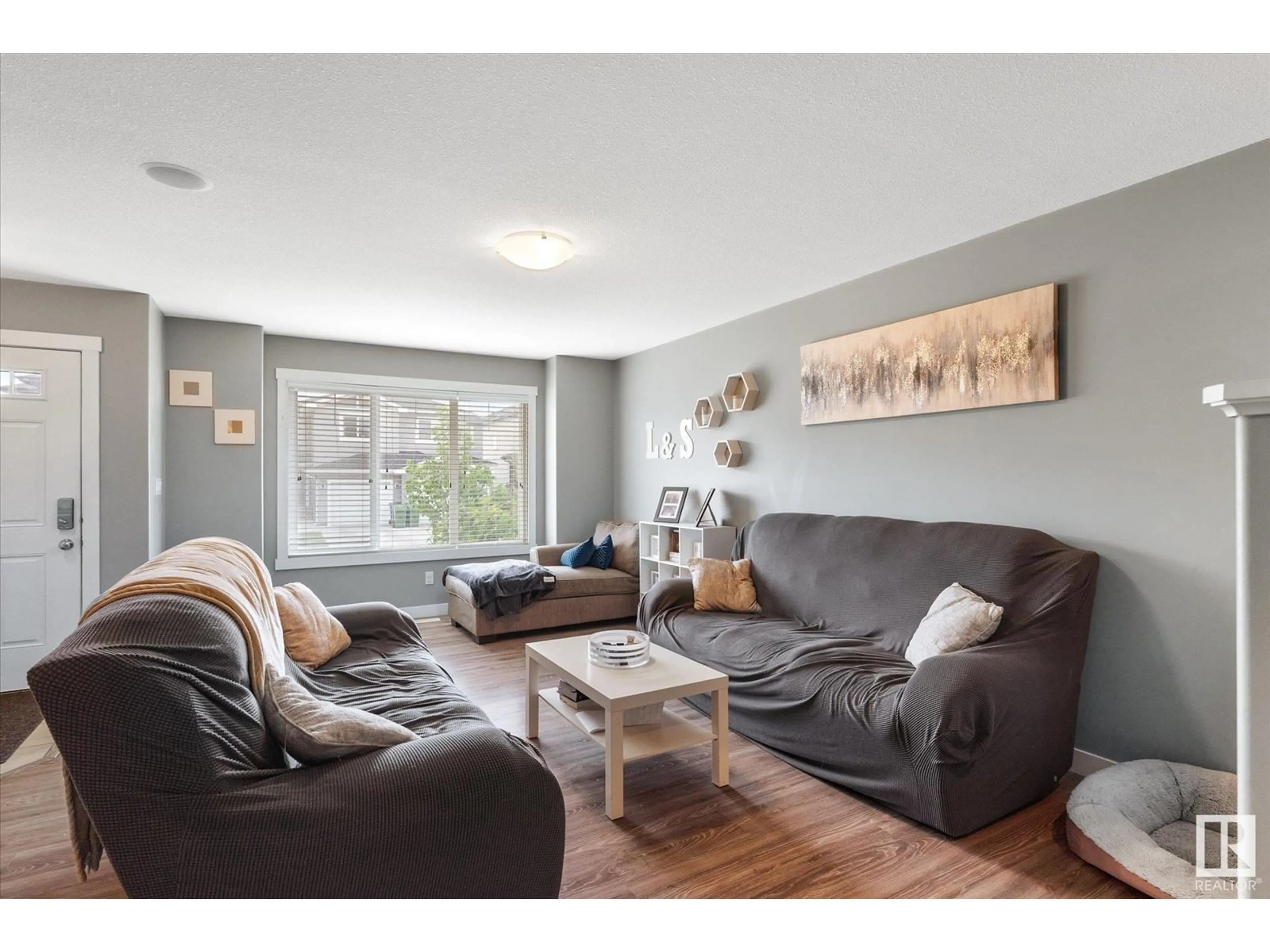 Living room with furniture, wood/laminate floor for 90 RICHMOND LI, Fort Saskatchewan Alberta T8L0S5