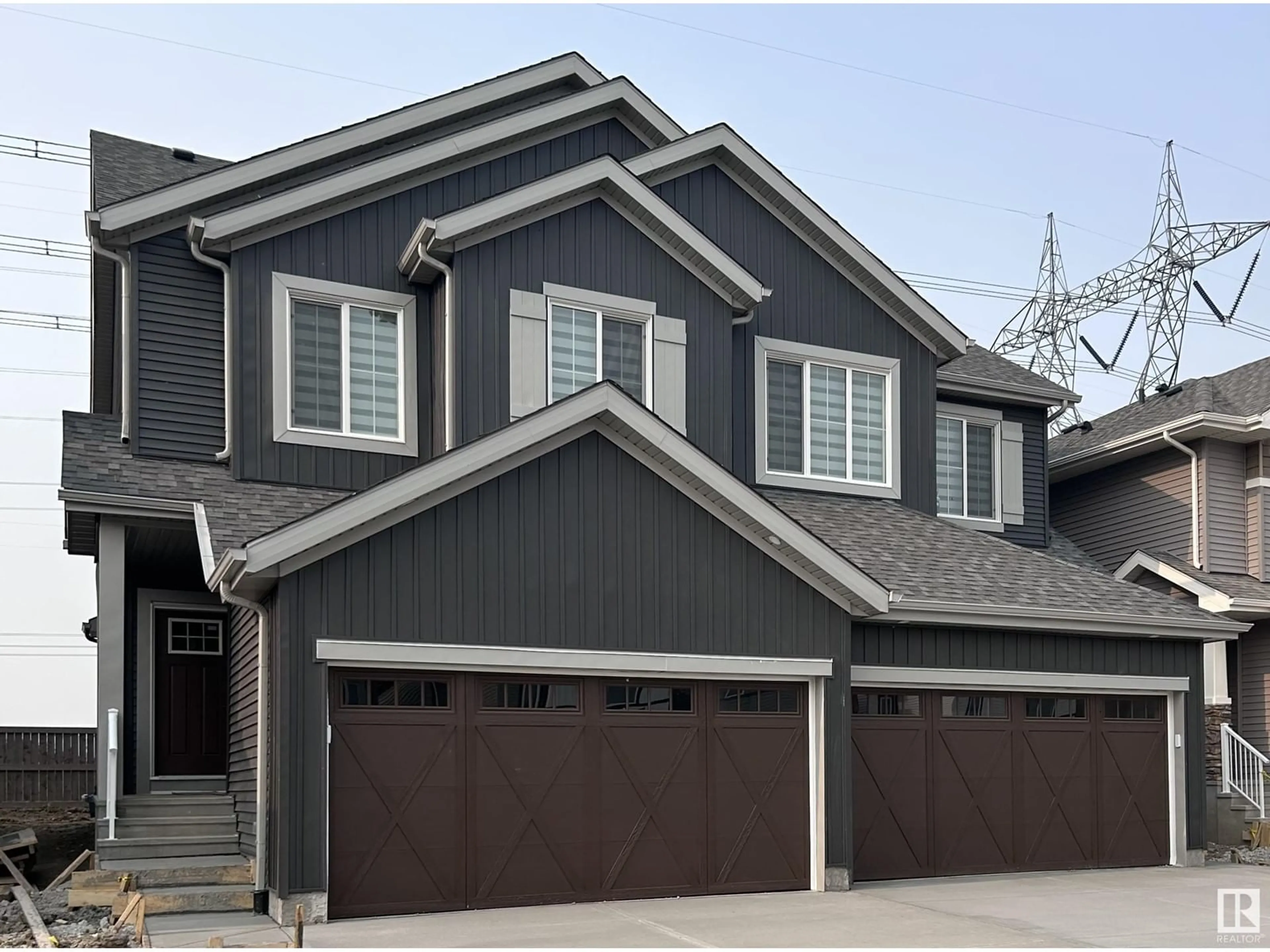 Home with vinyl exterior material, street for 19706 29 AV, Edmonton Alberta T6M1M2