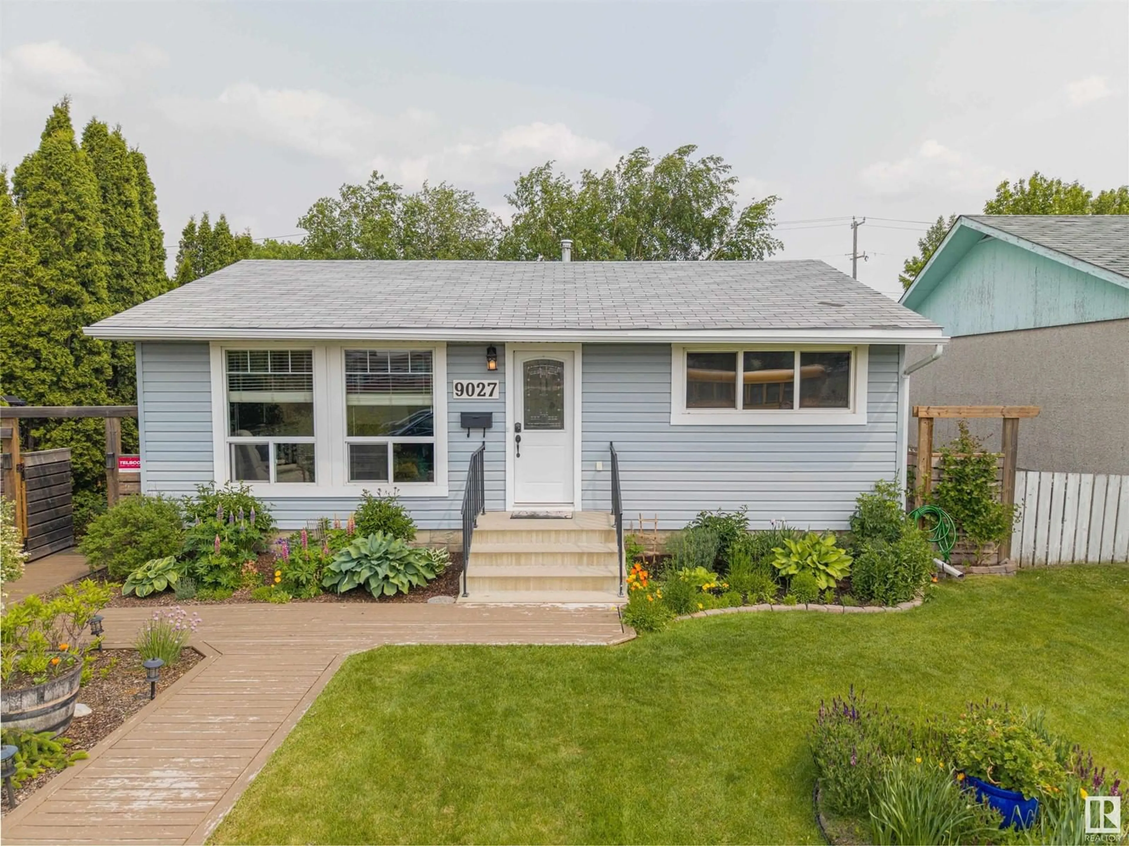 Home with vinyl exterior material, street for 9027 154 ST, Edmonton Alberta T5R1T1
