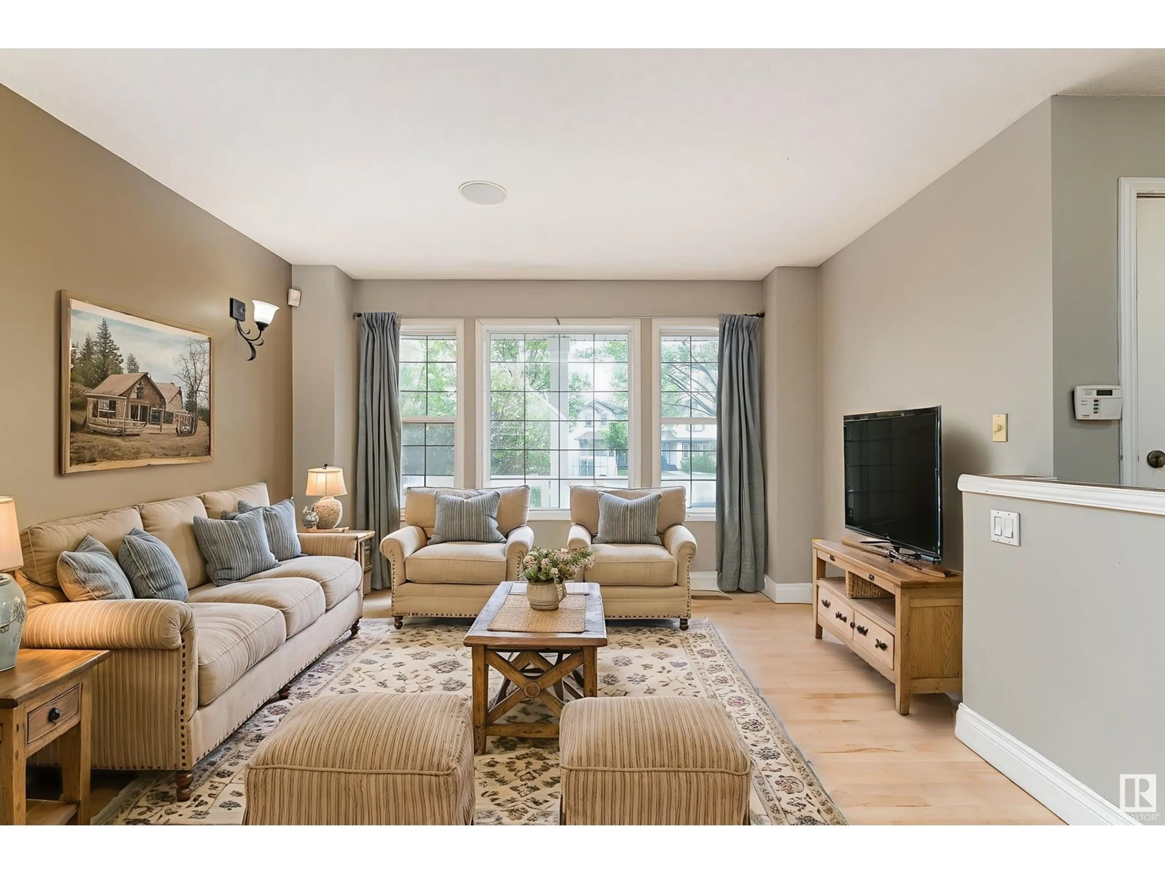 Living room with furniture, wood/laminate floor for 8 BETHEL DR, Sherwood Park Alberta T8H2G1