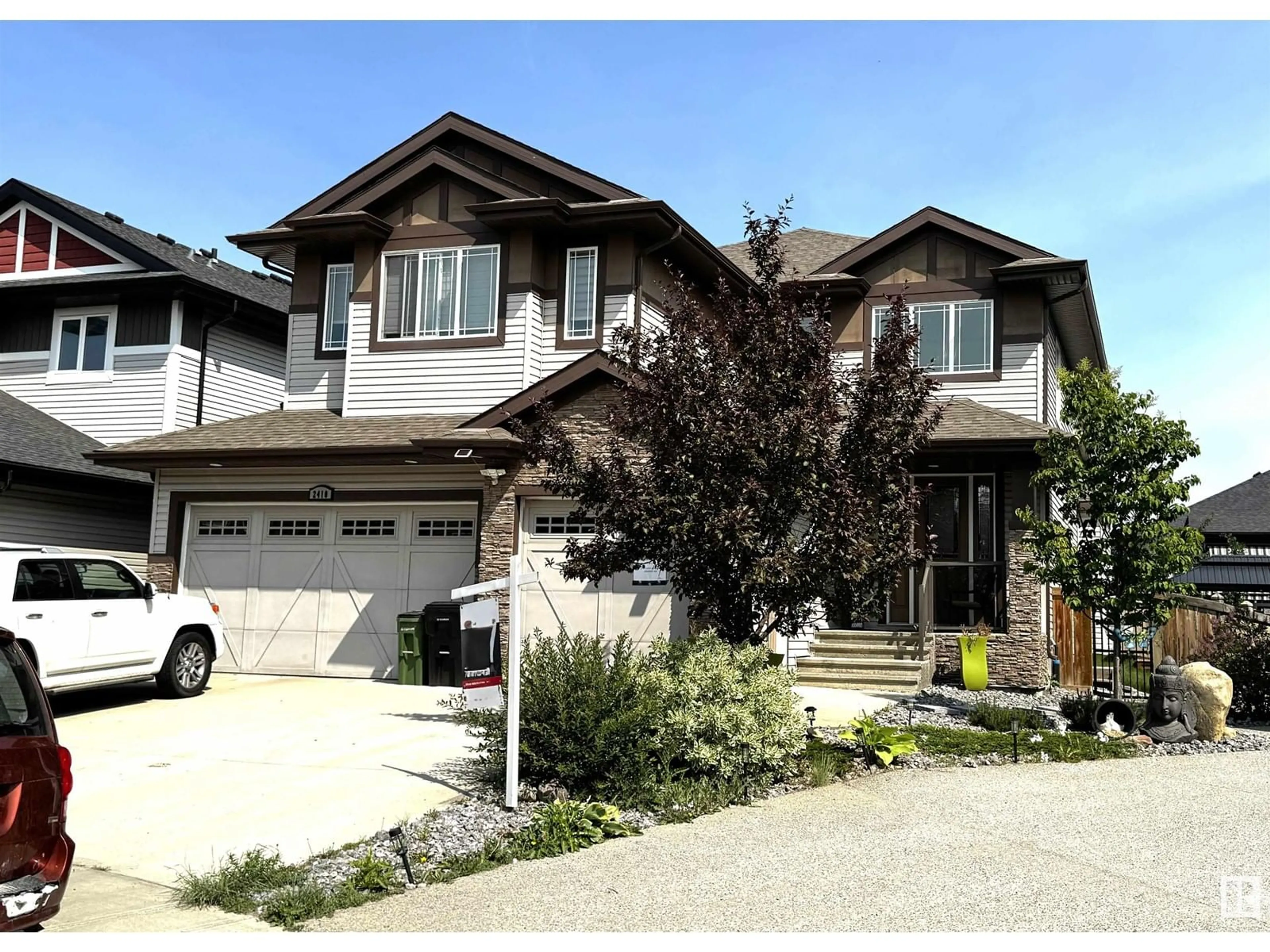 Home with vinyl exterior material, street for 2410 ASHCRAFT CR, Edmonton Alberta T6W2N1