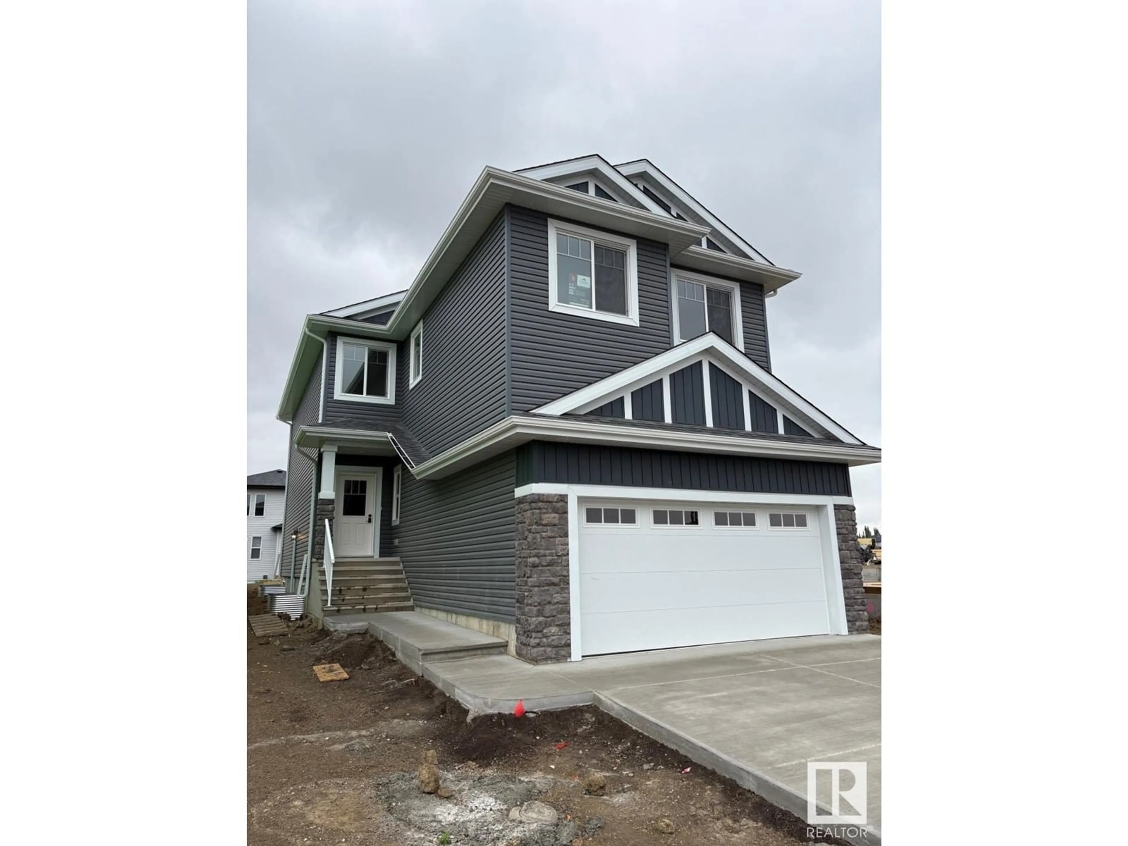 Home with vinyl exterior material, street for 6212 DANSEREAU CR, Beaumont Alberta T4X3E1