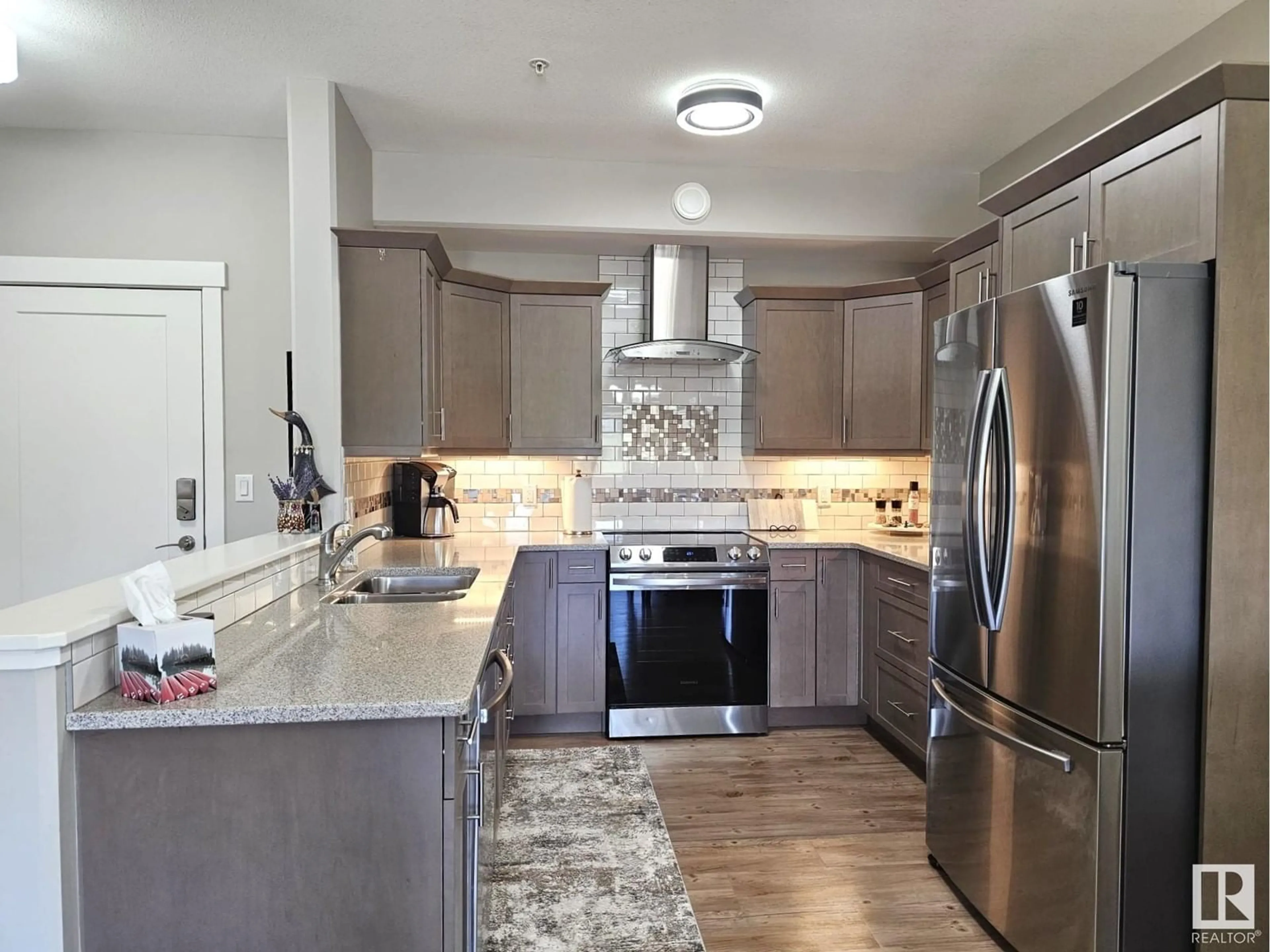 Open concept kitchen, ceramic/tile floor for #204 - 5201 BROUGHAM DR, Drayton Valley Alberta T7A0C8
