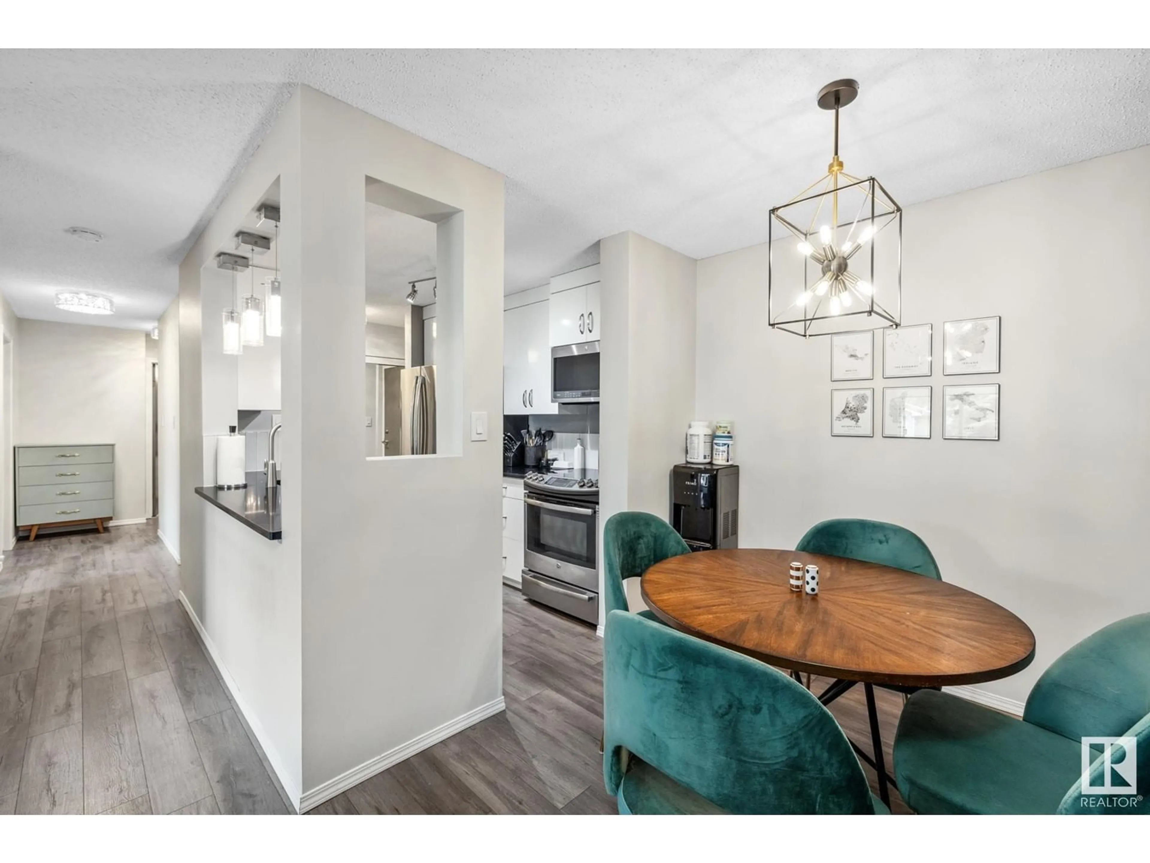 Open concept kitchen, wood/laminate floor for #223 - 6720 158 AV, Edmonton Alberta T5Z3B1