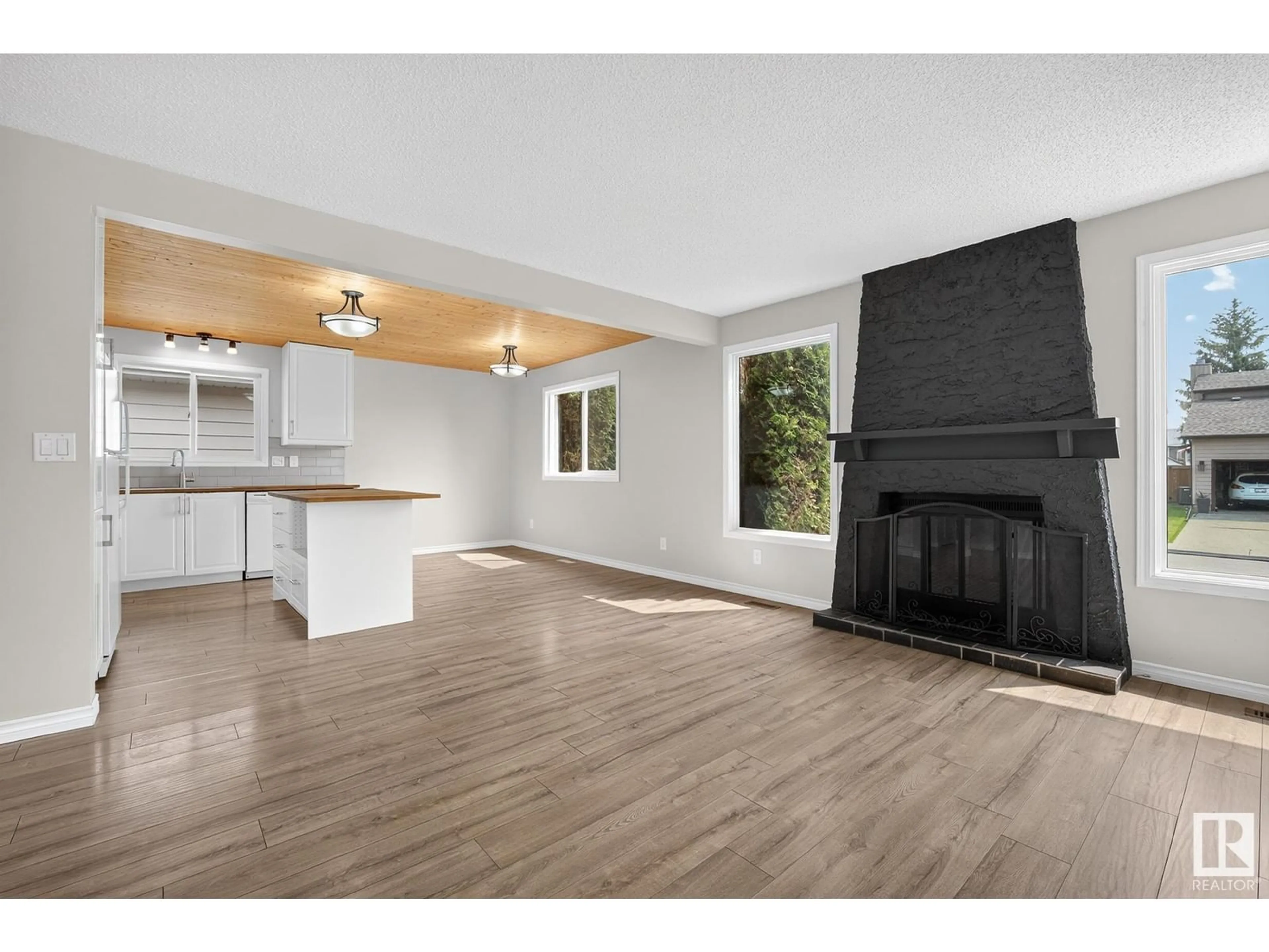 Open concept kitchen, wood/laminate floor for NW - 8328 152C AV, Edmonton Alberta T5E6E9