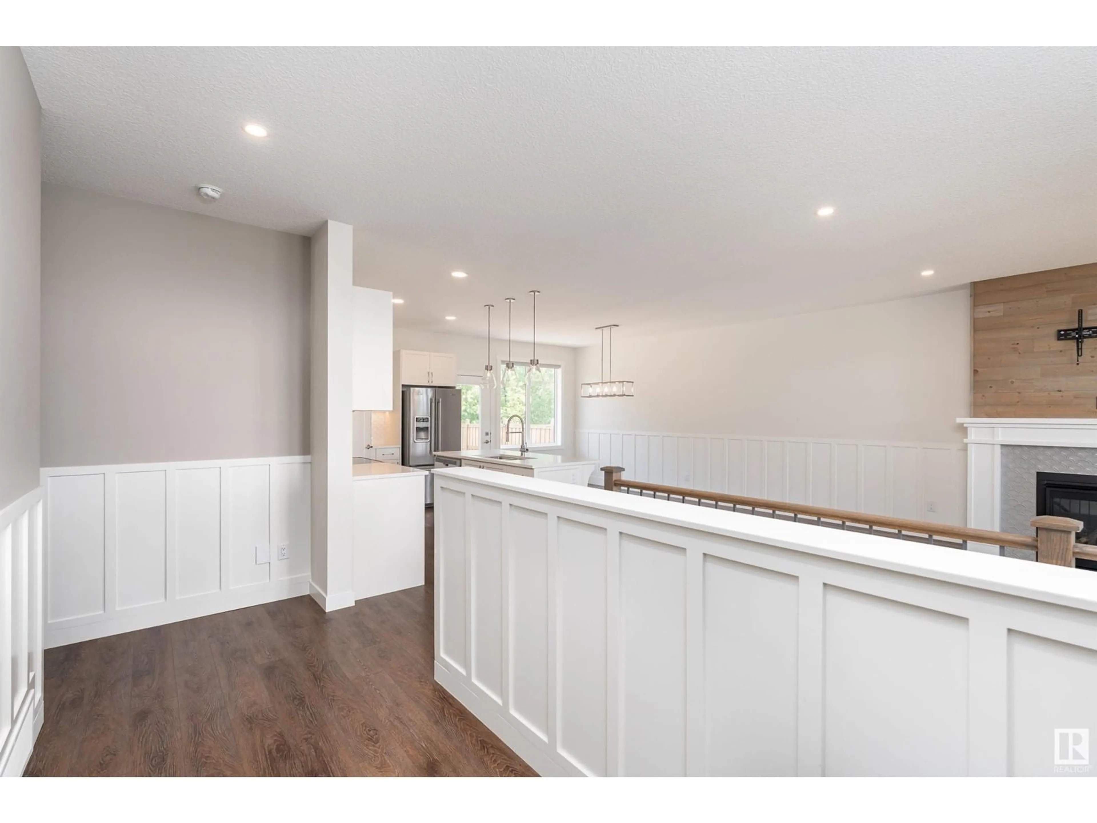 Open concept kitchen, wood/laminate floor for 55101 - 605 STE. ANNE TR, Rural Lac Ste. Anne County Alberta T0E1A1