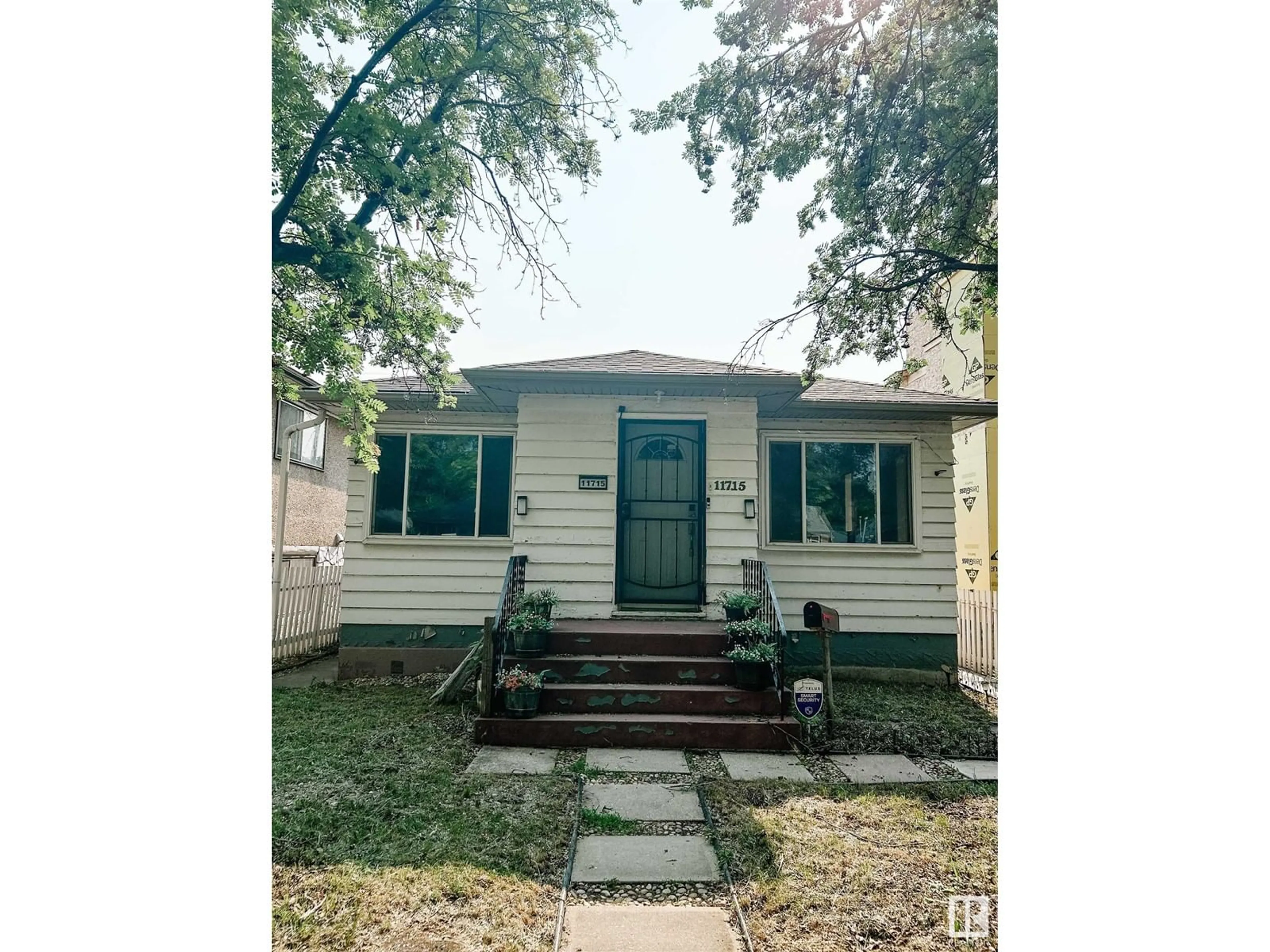 Home with vinyl exterior material, street for 11715 83 ST, Edmonton Alberta T5Z3Z8