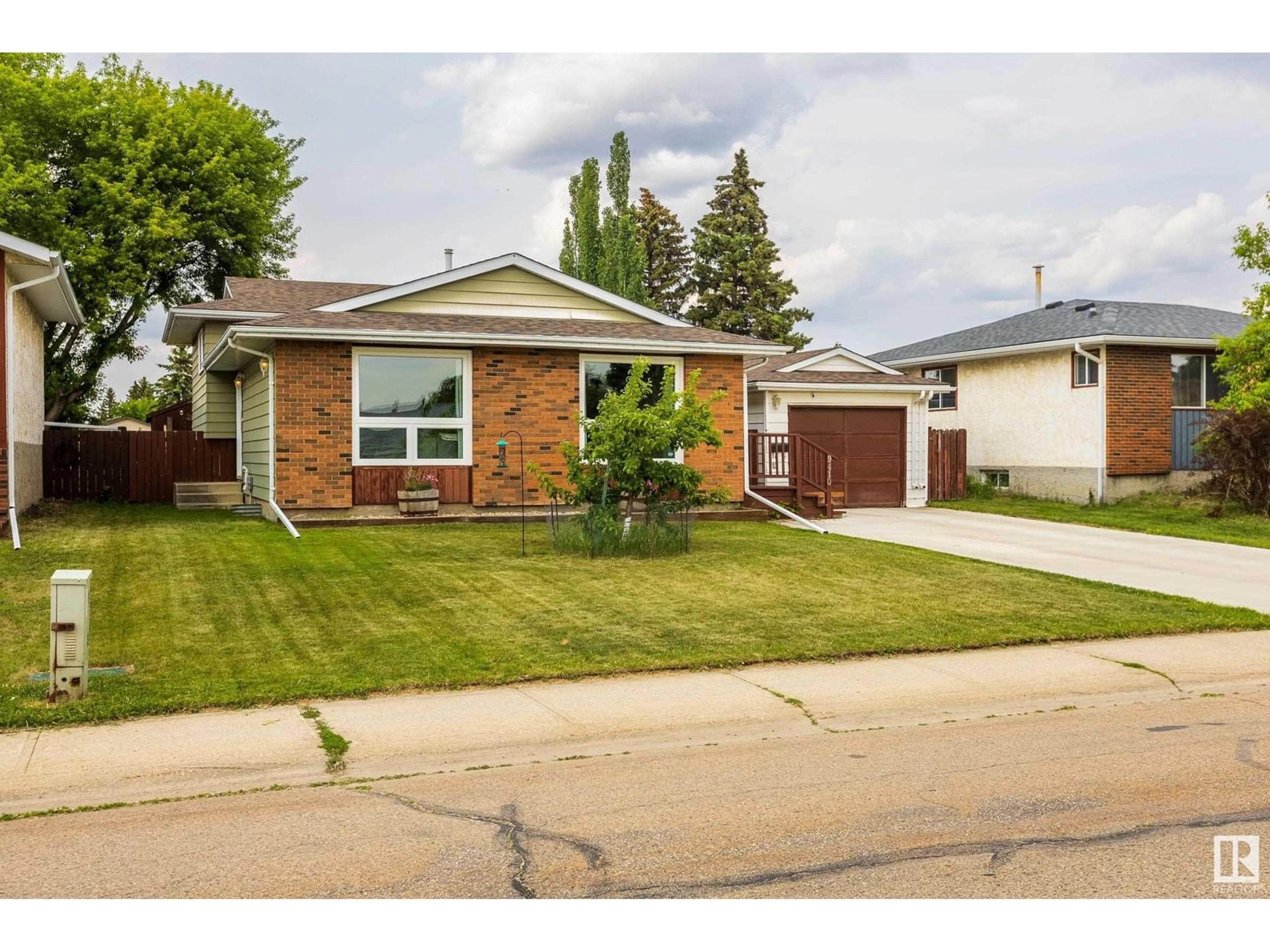 Home with brick exterior material, street for 9410 98 AV, Morinville Alberta T8R1J4