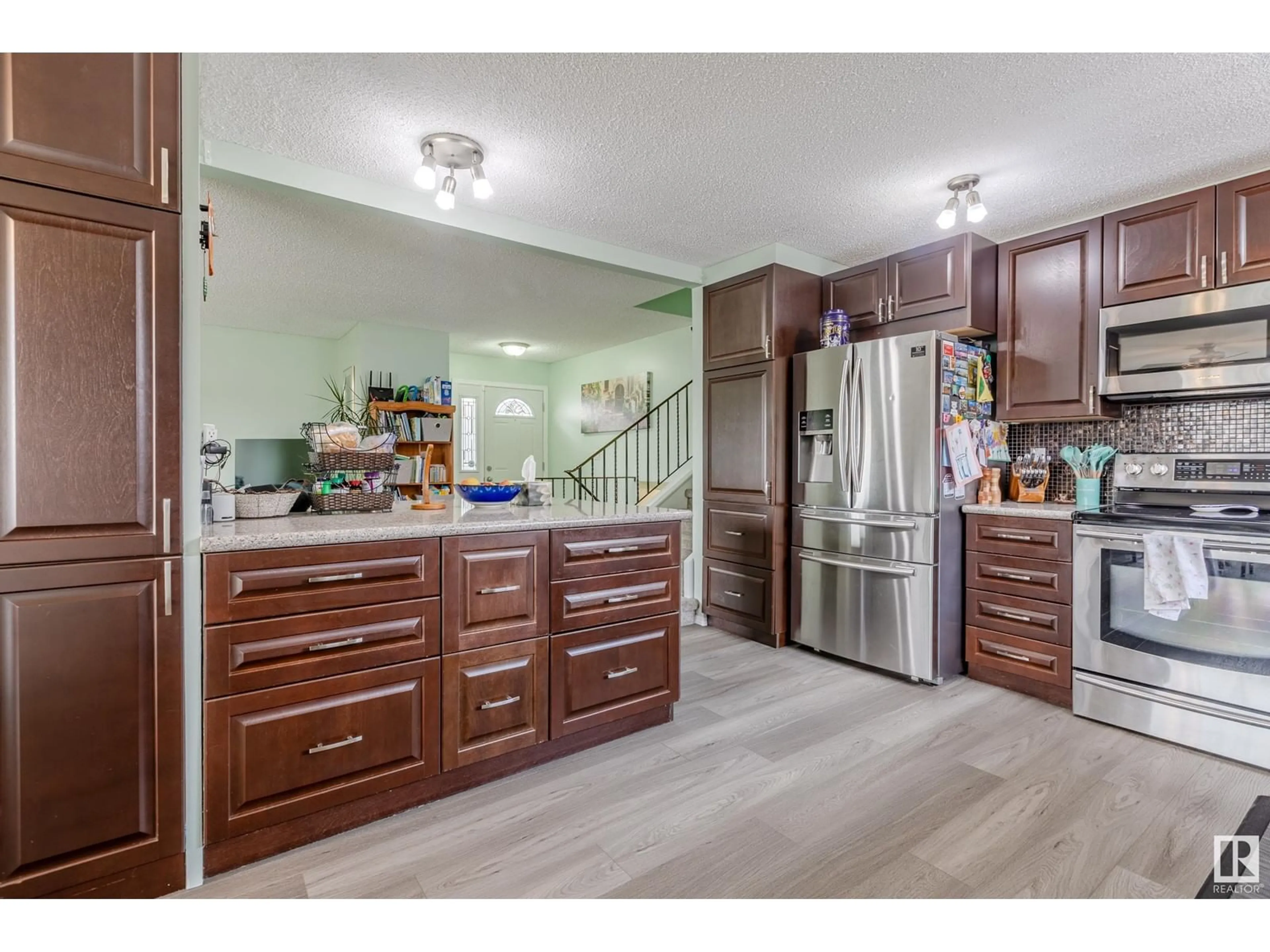 Open concept kitchen, wood/laminate floor for 9410 98 AV, Morinville Alberta T8R1J4