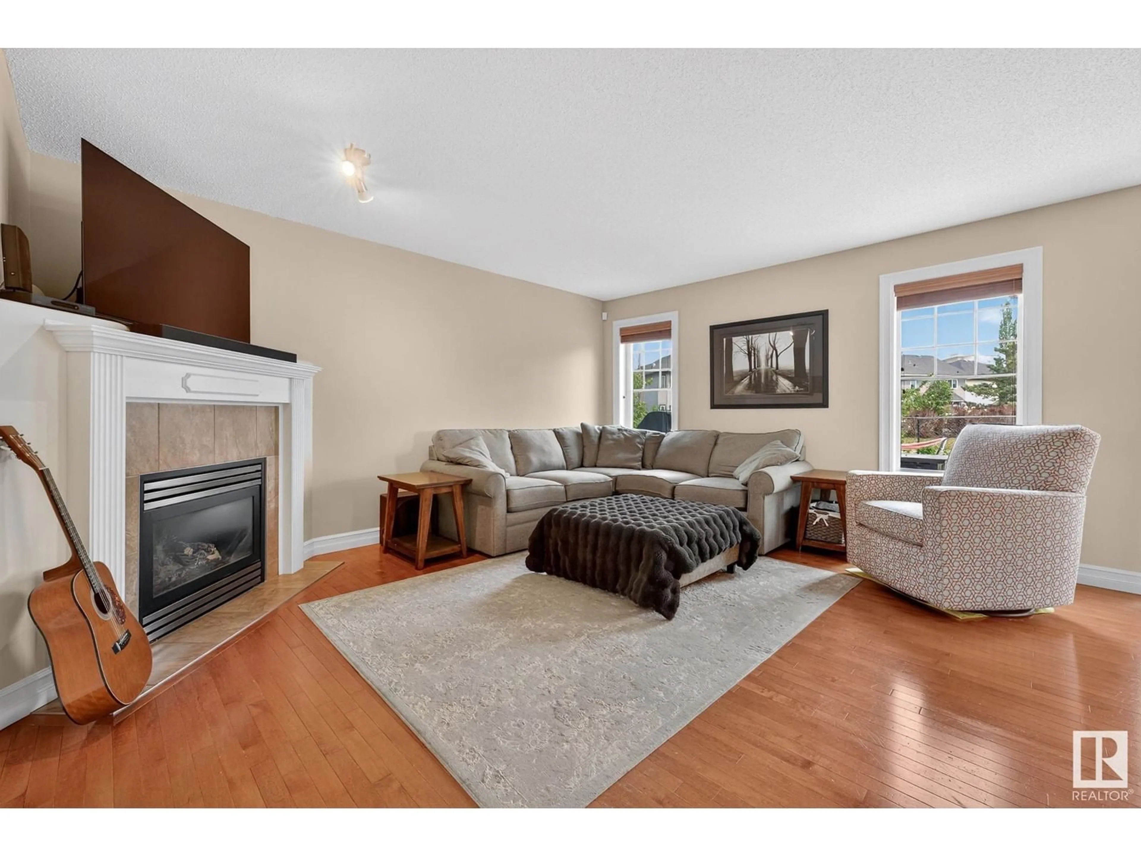 Living room with furniture, wood/laminate floor for 7272 ESSEX WY, Sherwood Park Alberta T8H0L2