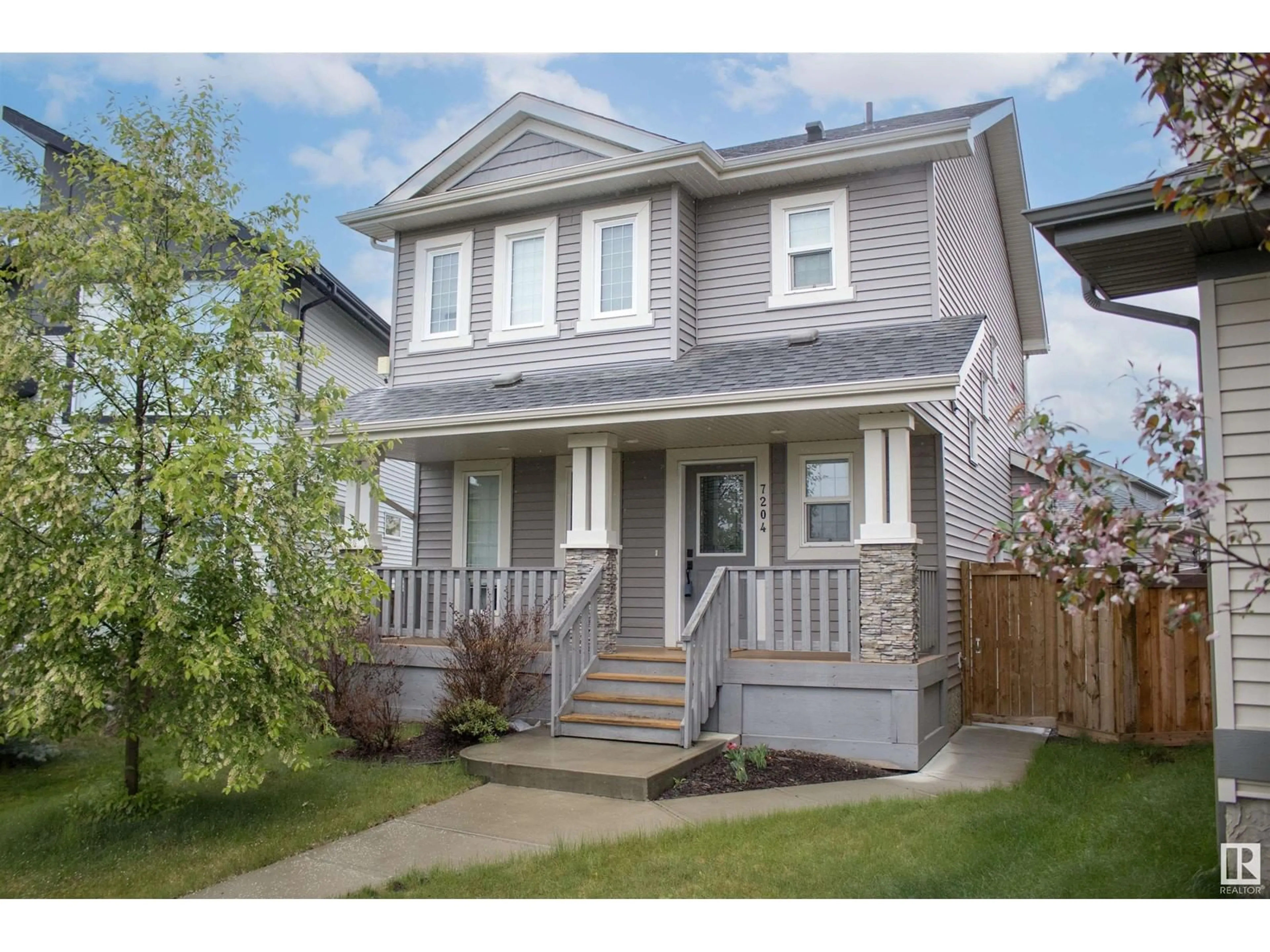Home with vinyl exterior material, street for 7204 CARDINAL WY, Edmonton Alberta T6W2Y5
