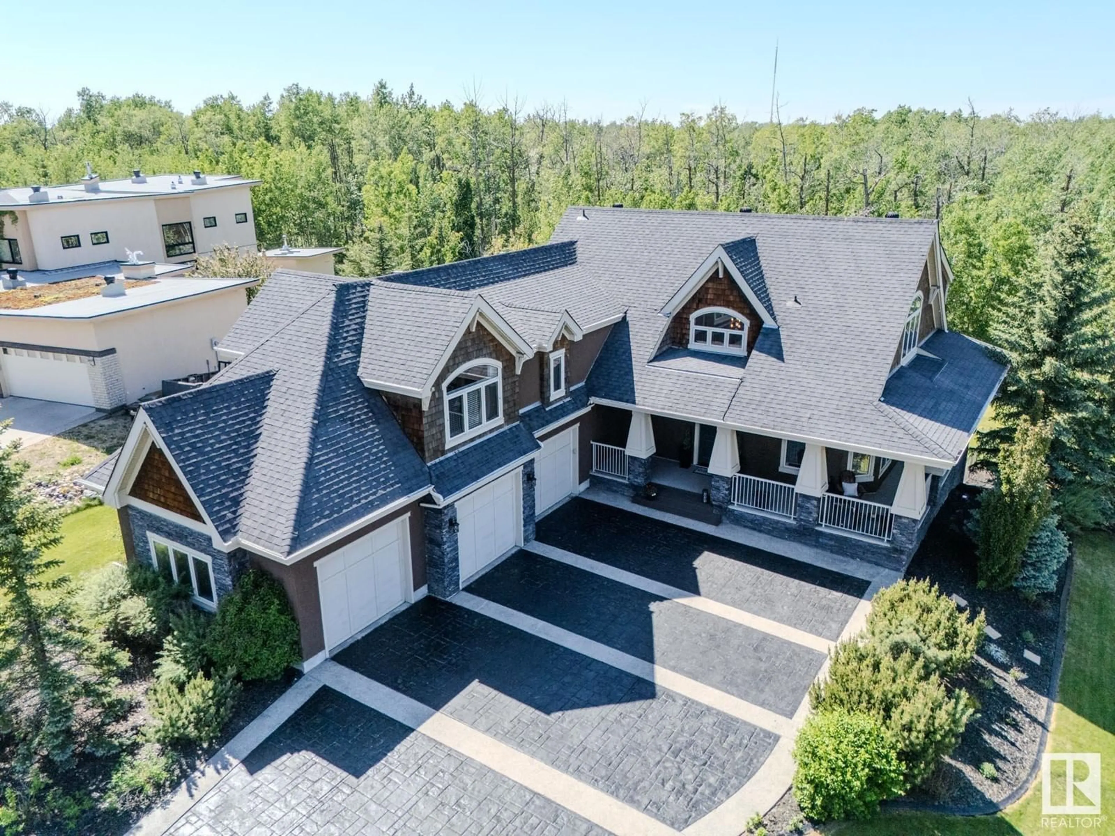A pic from outside/outdoor area/front of a property/back of a property/a pic from drone, unknown for 23033 - 27 WYE RD, Rural Strathcona County Alberta T8B1H9