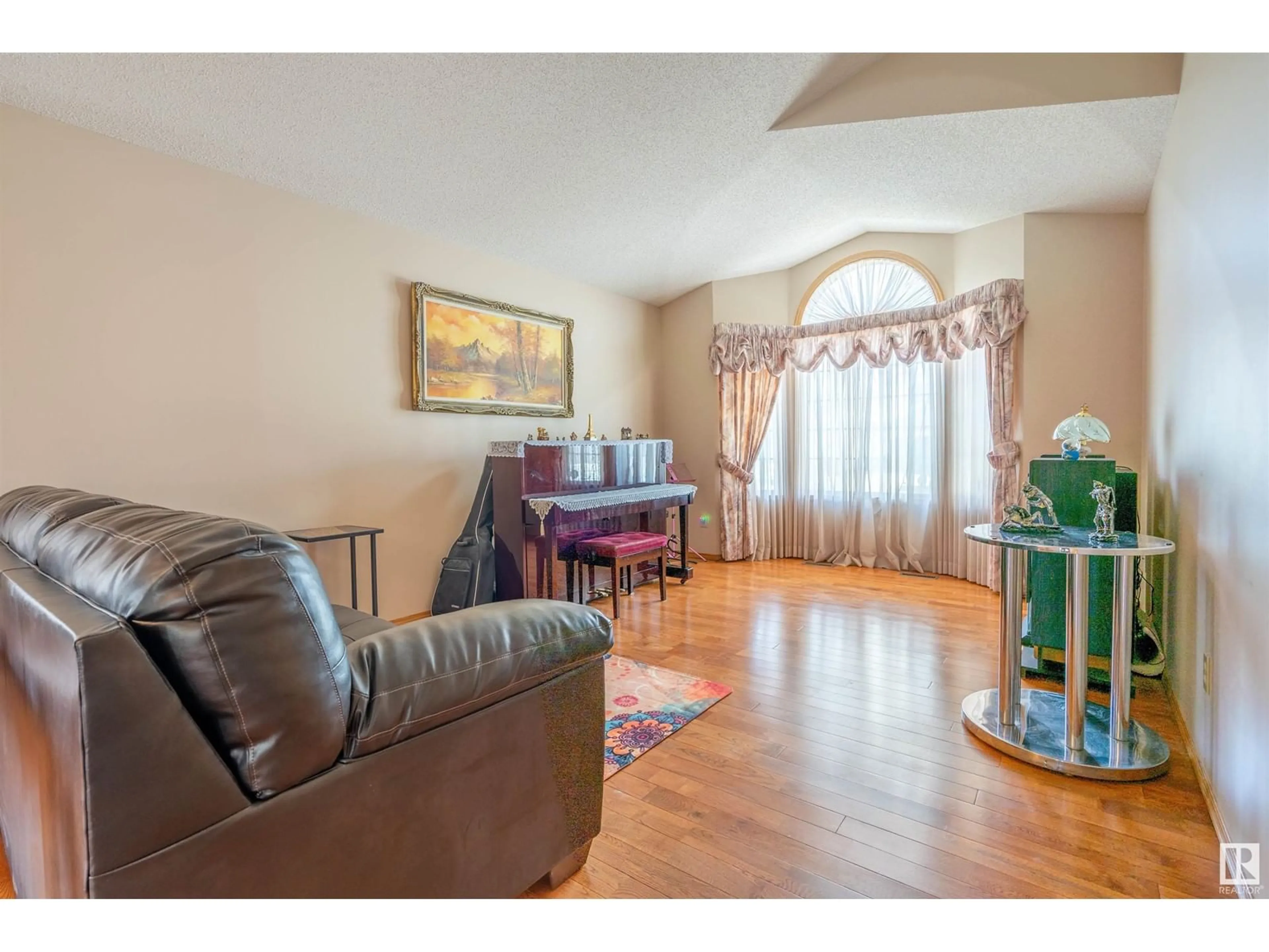 Living room with furniture, wood/laminate floor for 17411 98 ST, Edmonton Alberta T5X5V5