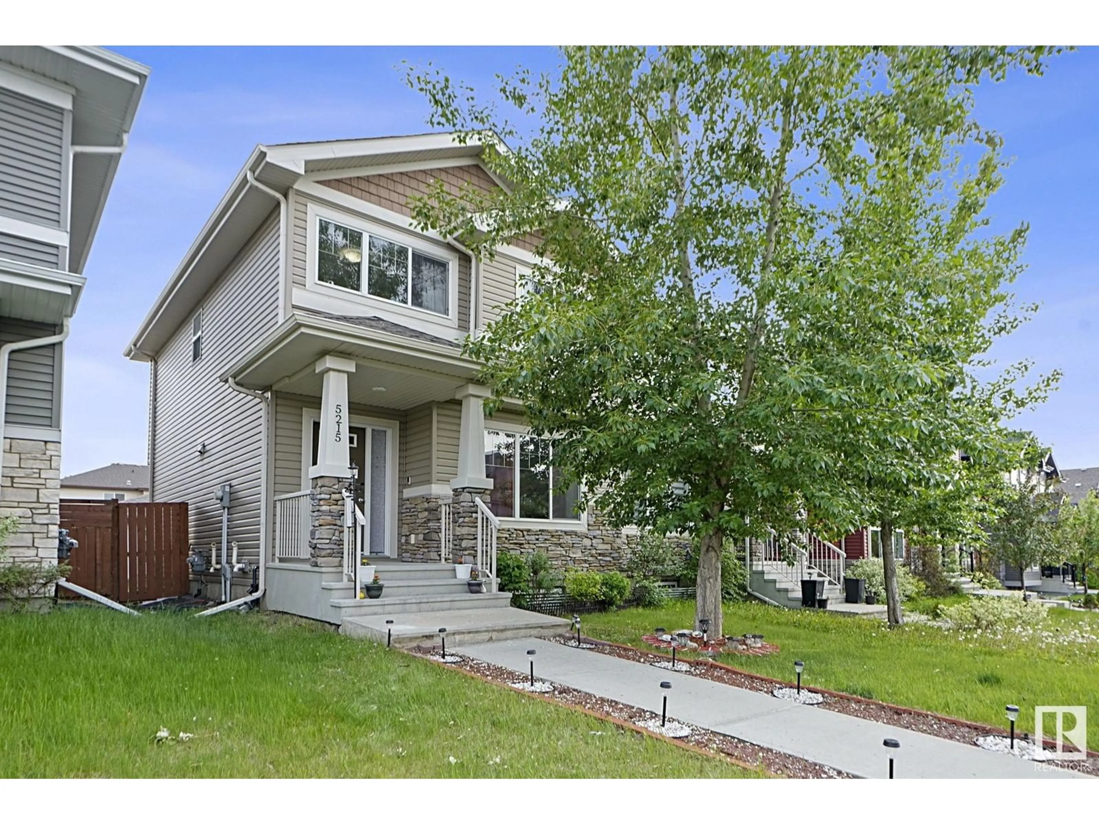 Home with vinyl exterior material, street for 5215 20AVE SW, Edmonton Alberta T6X1V6