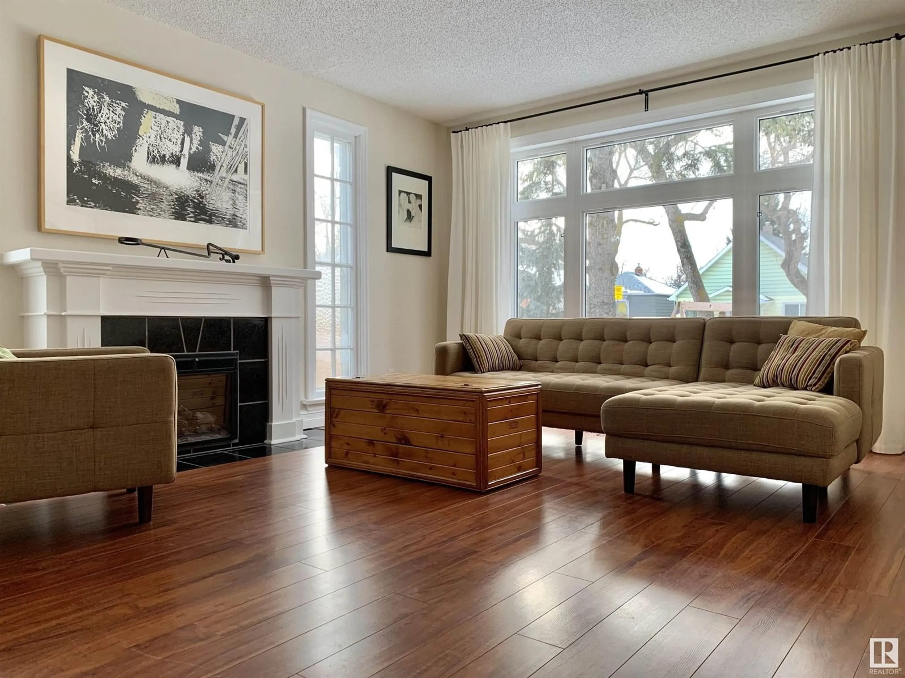 Living room with furniture, wood/laminate floor for NW - 12017 95A ST, Edmonton Alberta T5G1R6