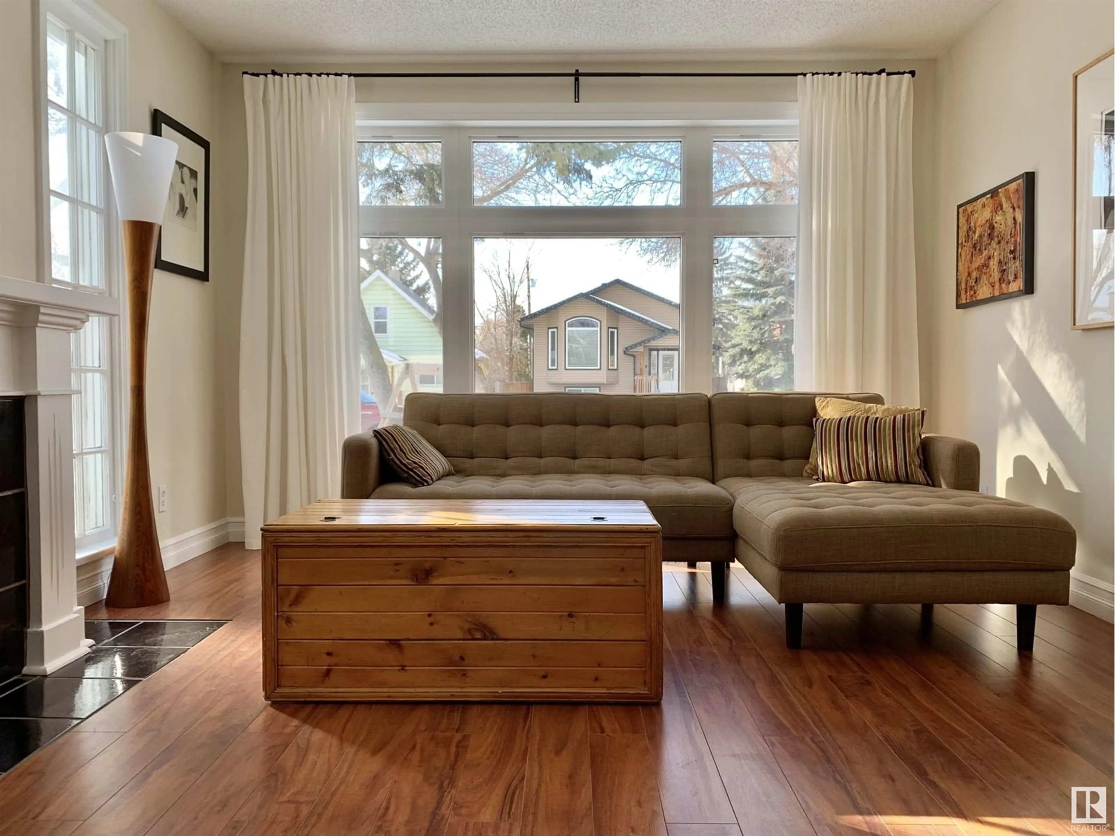 Living room with furniture, wood/laminate floor for NW - 12017 95A ST, Edmonton Alberta T5G1R6