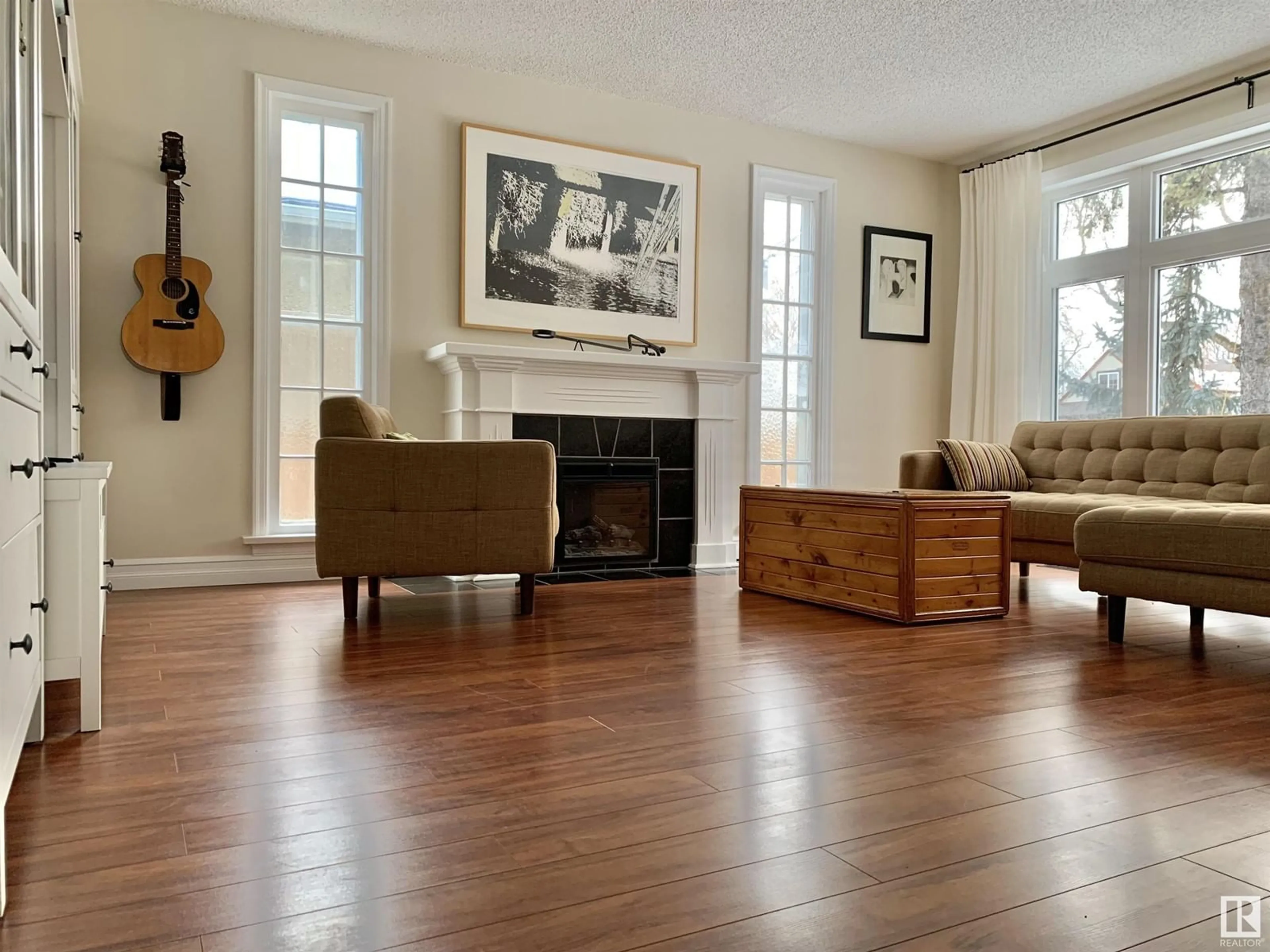 Living room with furniture, wood/laminate floor for NW - 12017 95A ST, Edmonton Alberta T5G1R6