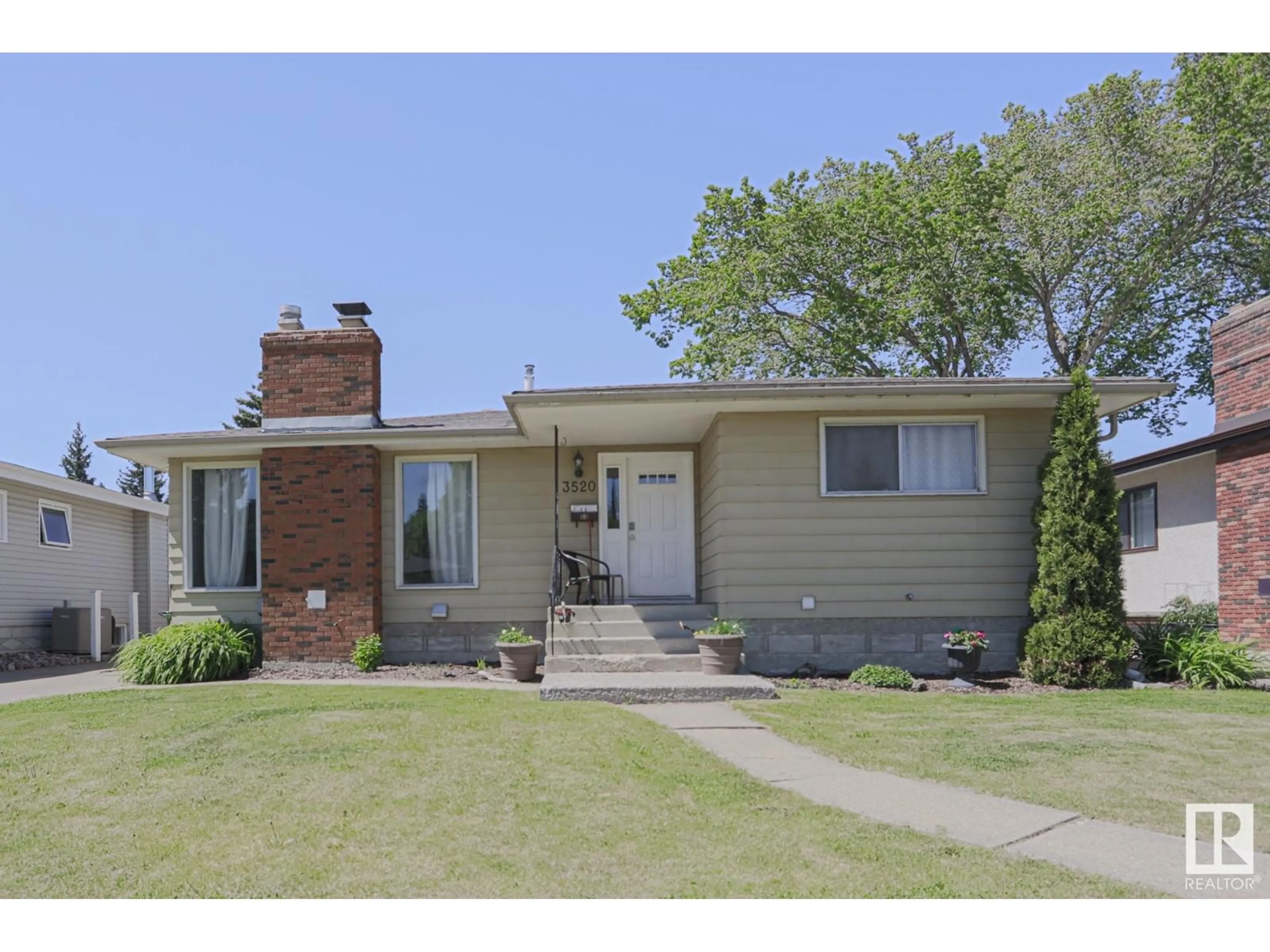 Home with brick exterior material, street for NW - 3520 105B ST, Edmonton Alberta T6J2L1