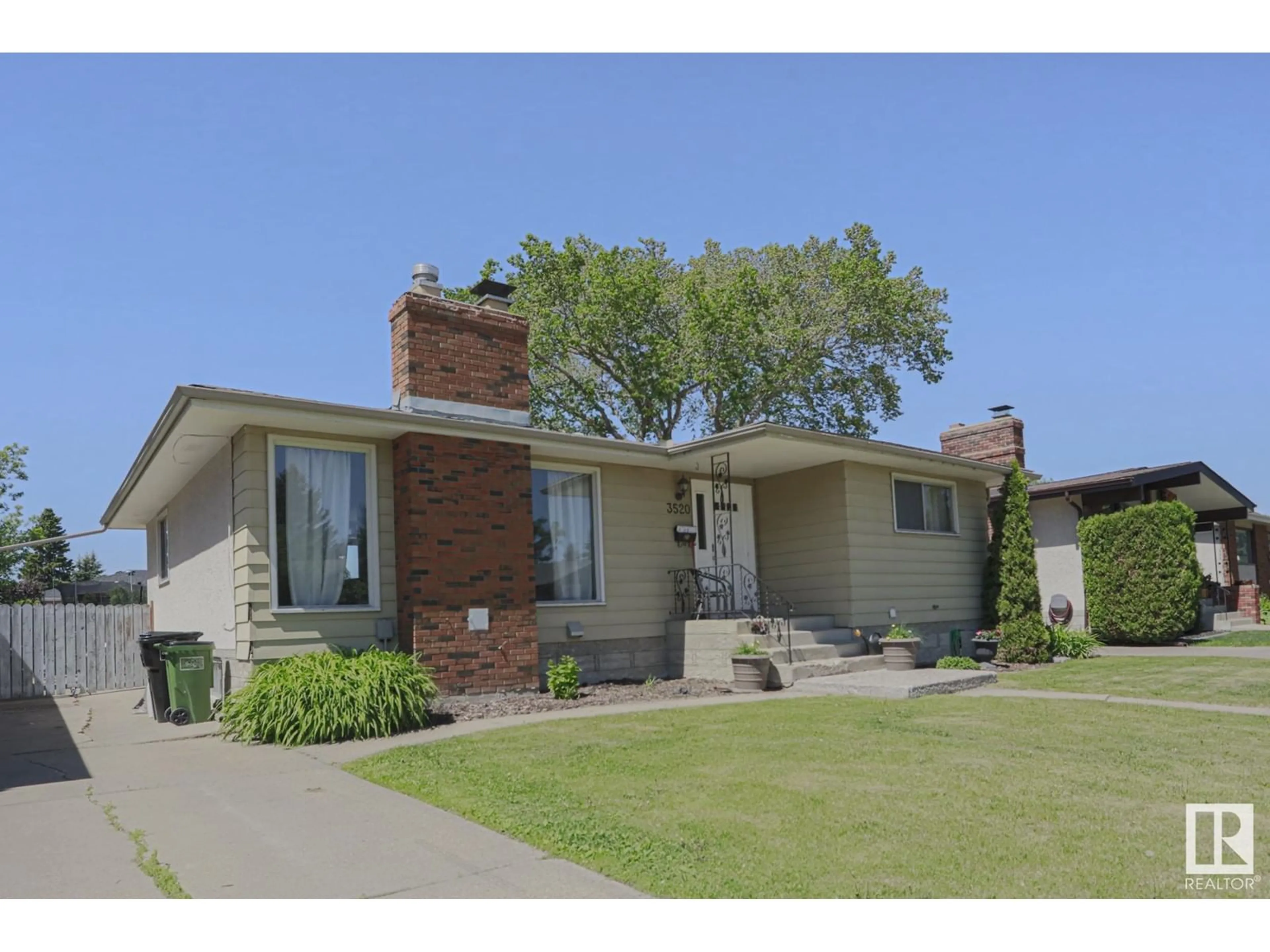 Home with brick exterior material, street for NW - 3520 105B ST, Edmonton Alberta T6J2L1