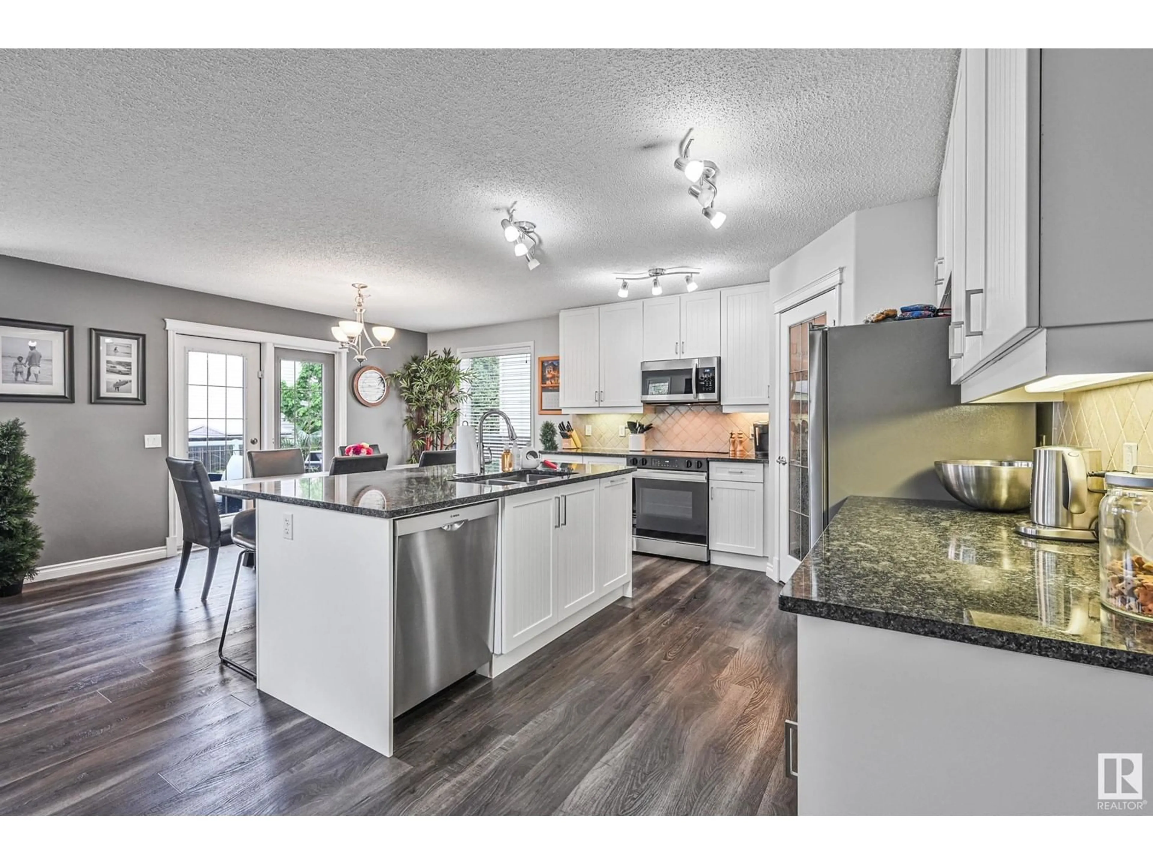 Open concept kitchen, wood/laminate floor for 200 FOXTAIL WY, Sherwood Park Alberta T8A2H4
