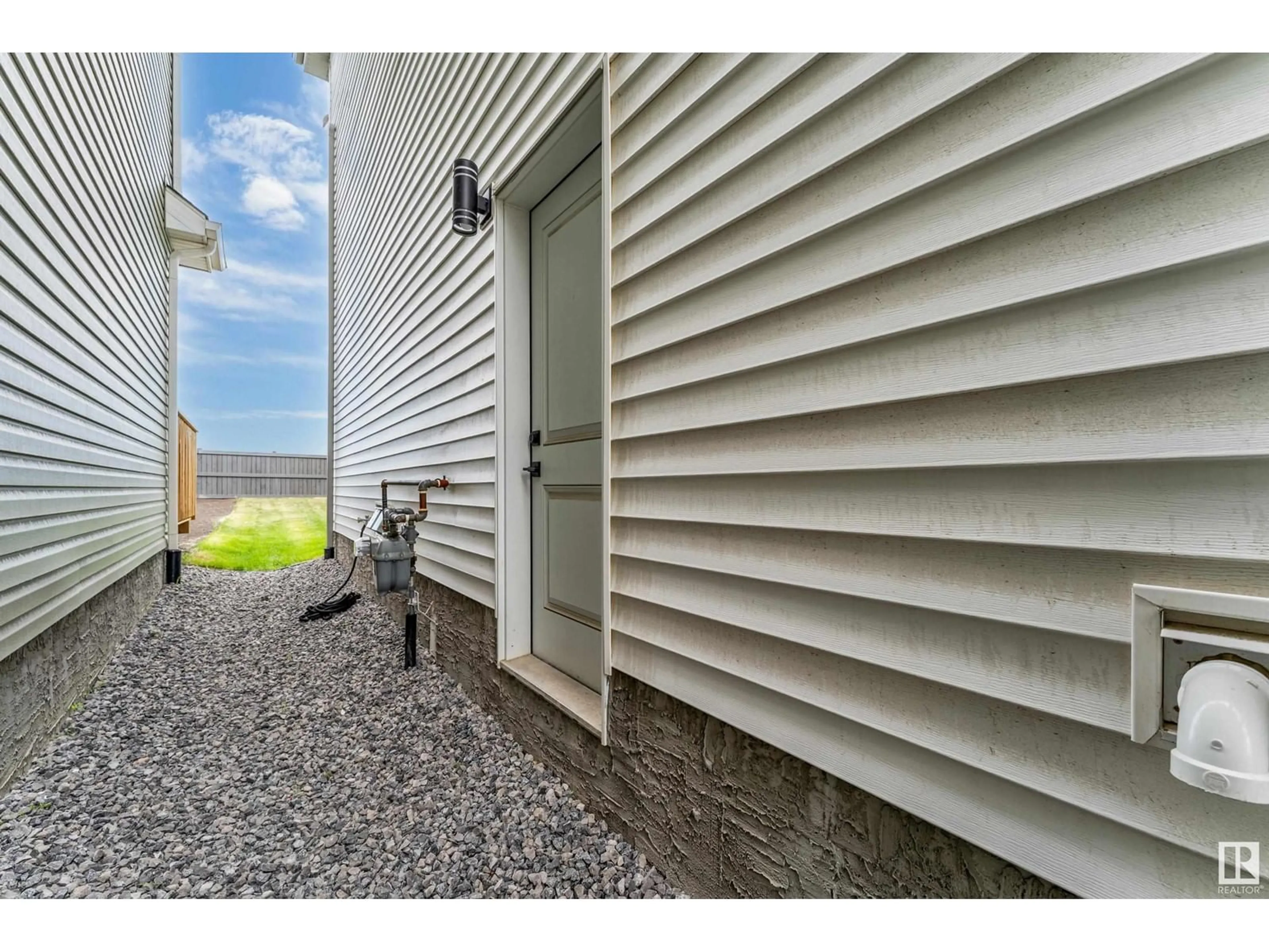 Home with vinyl exterior material, street for NW - 4816 177 AV, Edmonton Alberta T5Y3Y1