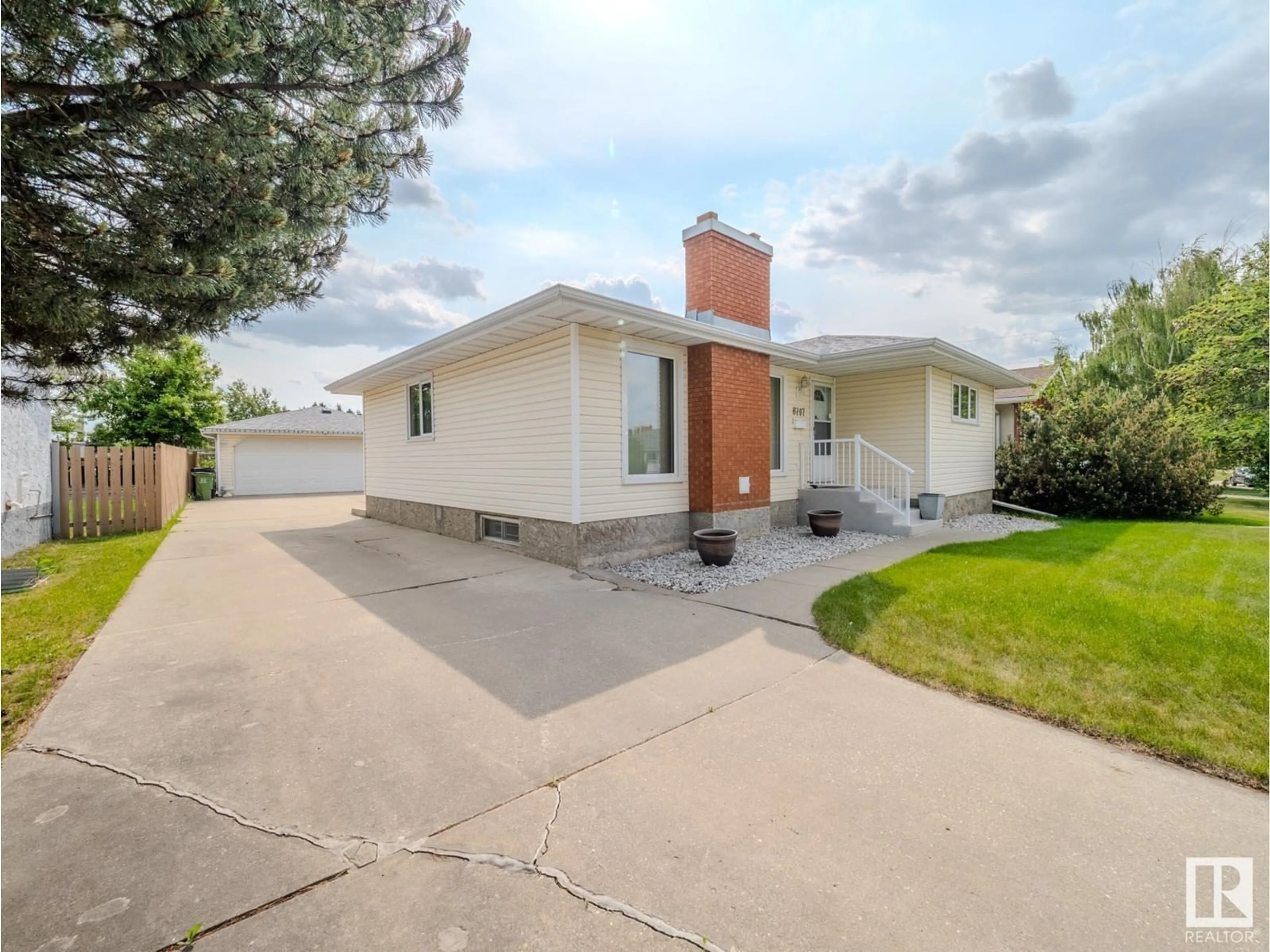 Home with vinyl exterior material, street for 8707 16 AV, Edmonton Alberta T6K2A4