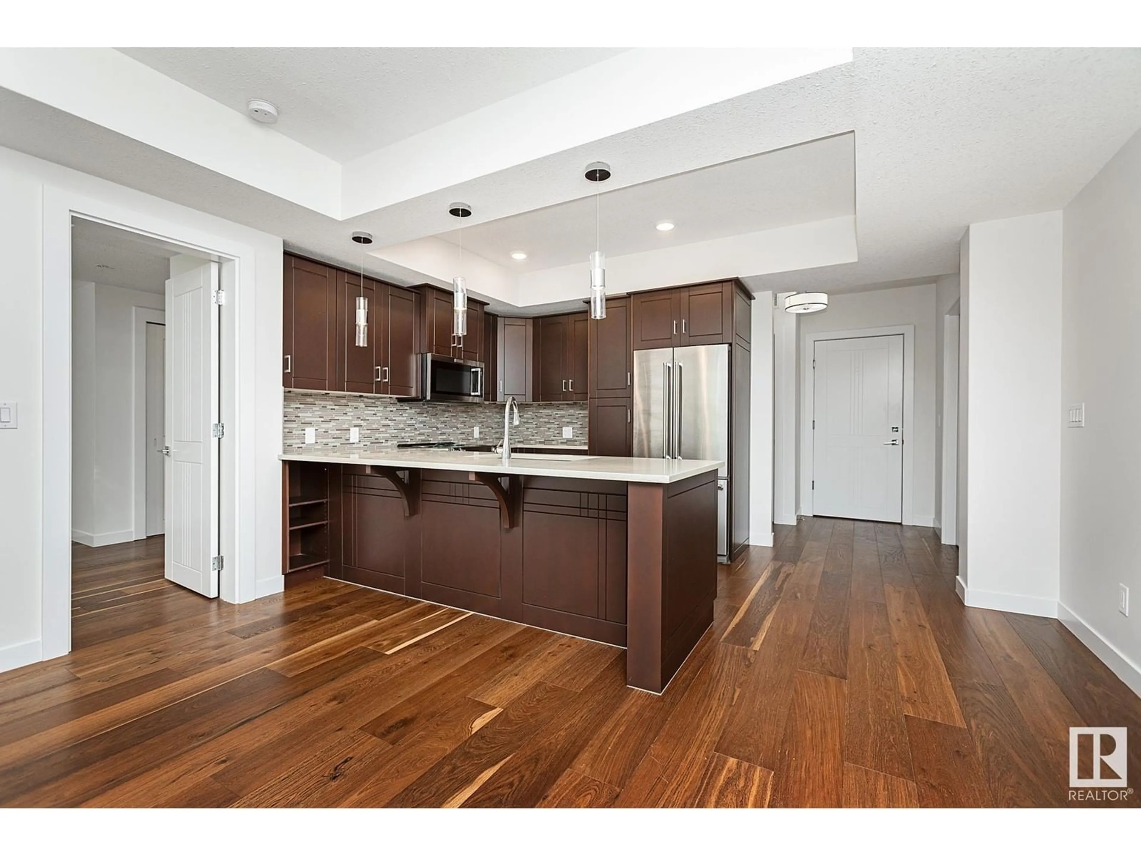 Open concept kitchen, wood/laminate floor for #212 - 212 FESTIVAL WY, Sherwood Park Alberta T8A4Z1