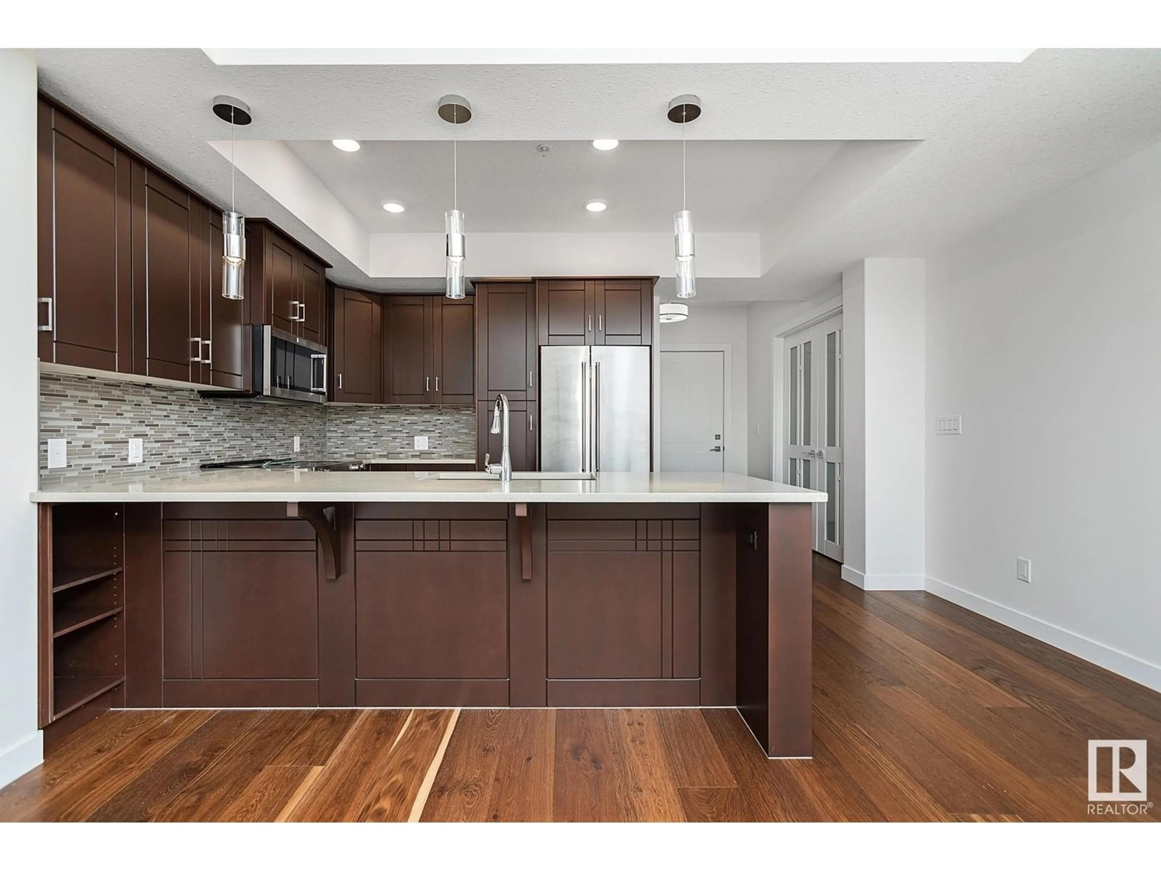 Open concept kitchen, wood/laminate floor for #212 - 212 FESTIVAL WY, Sherwood Park Alberta T8A4Z1