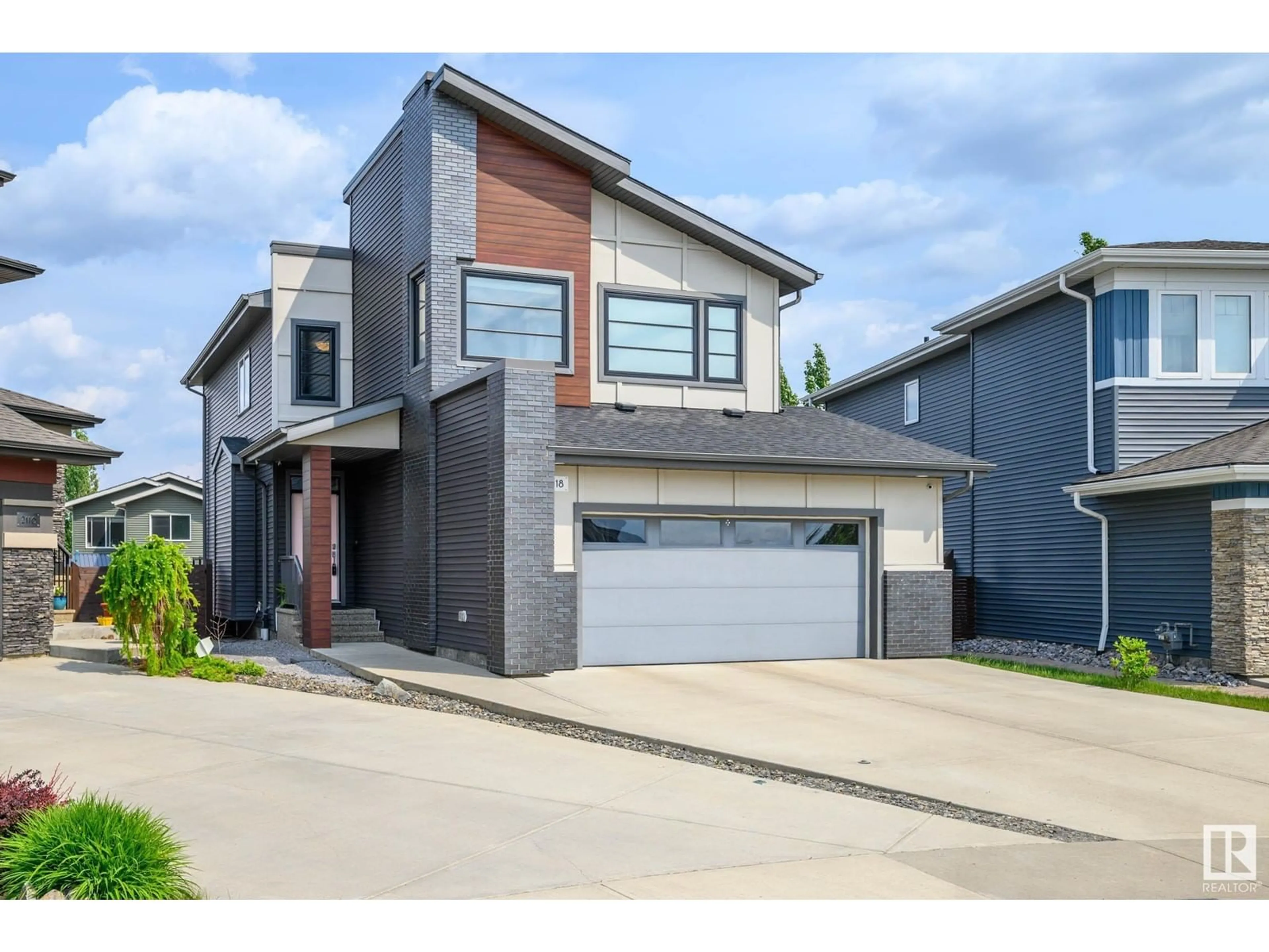 Home with brick exterior material, street for 2118 WARE RD, Edmonton Alberta T6W2T9