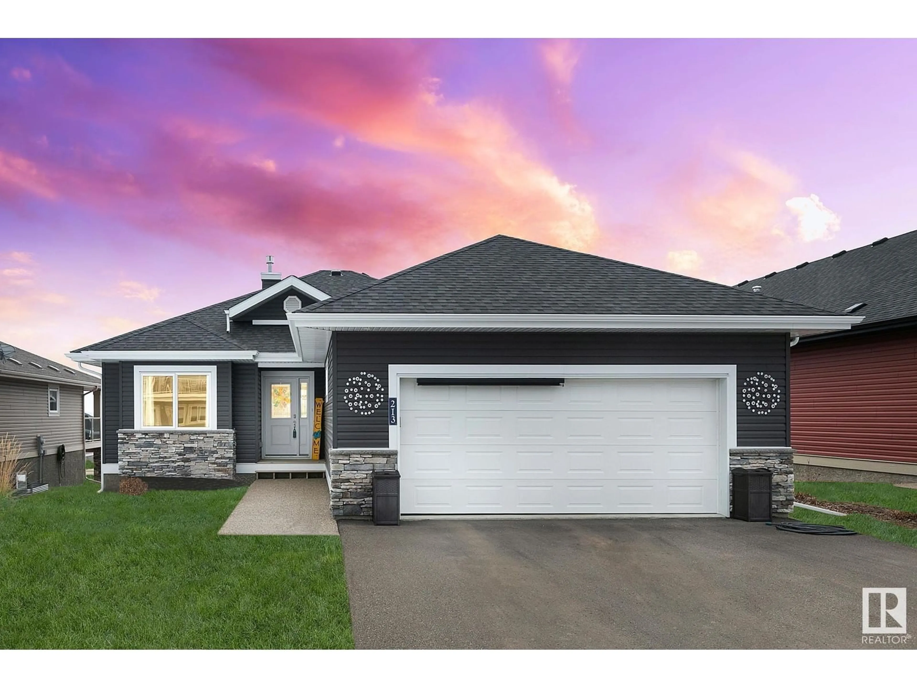 Home with vinyl exterior material, street for #213 - 55101 STE. ANNE TR, Rural Lac Ste. Anne County Alberta T0E0L0