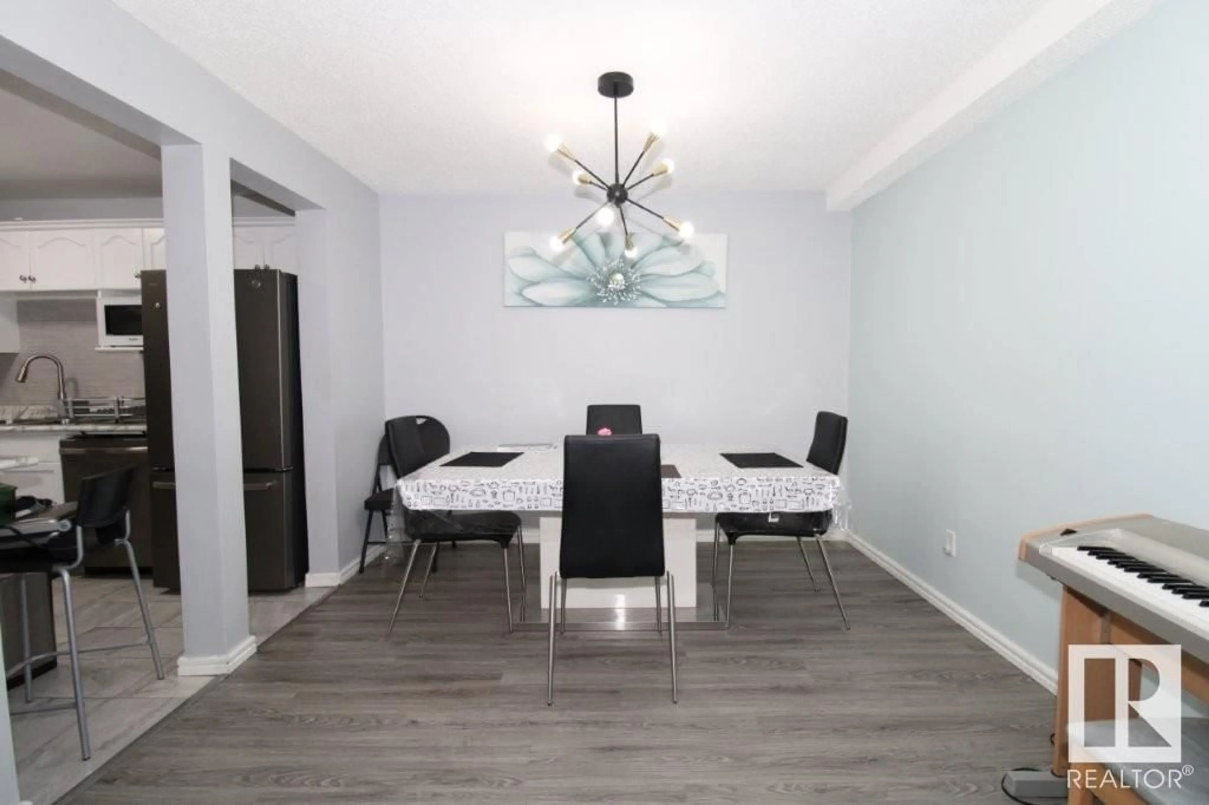 Dining room, wood/laminate floor for #104 - 1620 48 ST, Edmonton Alberta T6L5P1