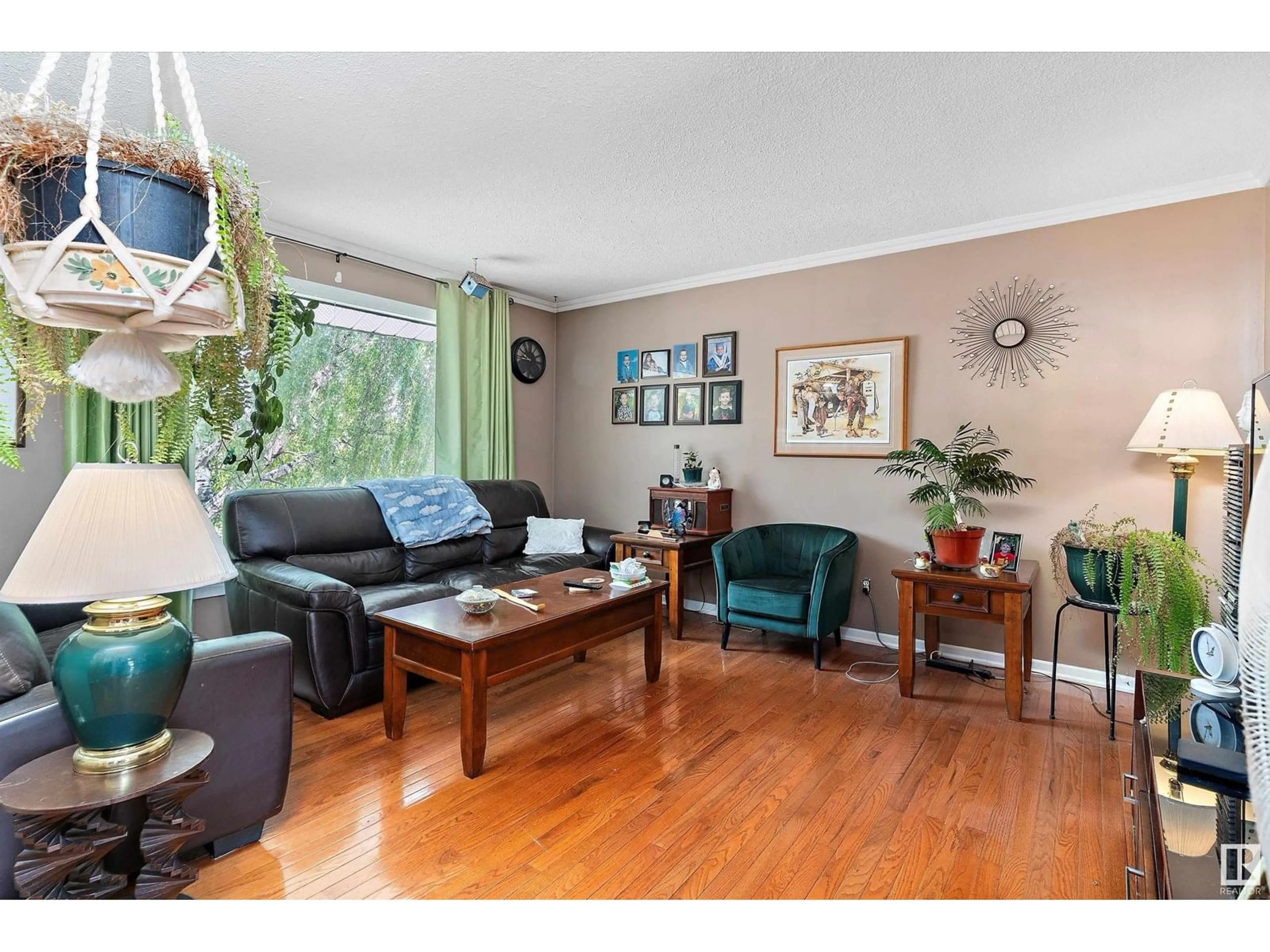 Living room with furniture, wood/laminate floor for 13212 128 AV, Edmonton Alberta T5L3H2