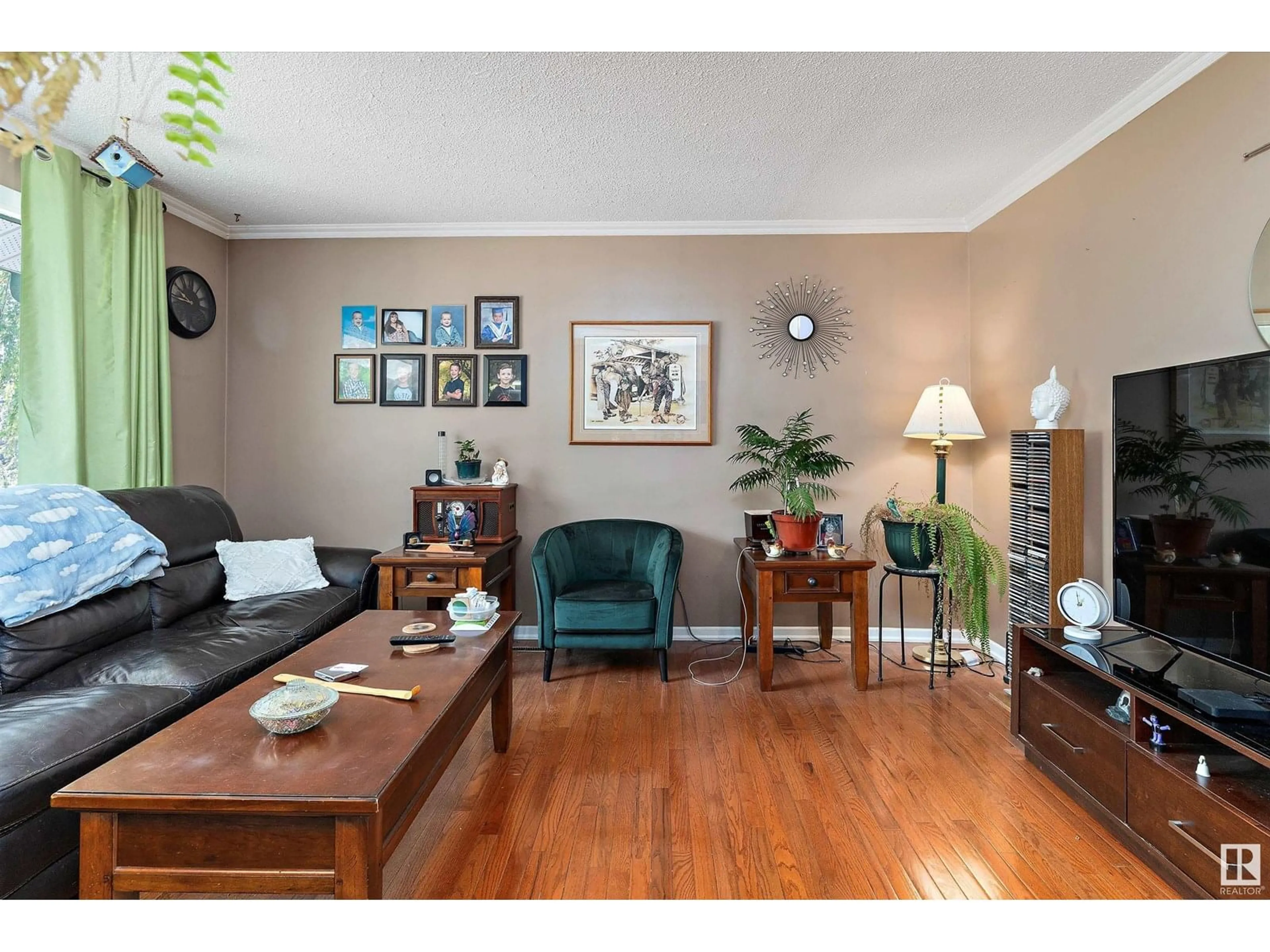 Living room with furniture, wood/laminate floor for 13212 128 AV, Edmonton Alberta T5L3H2