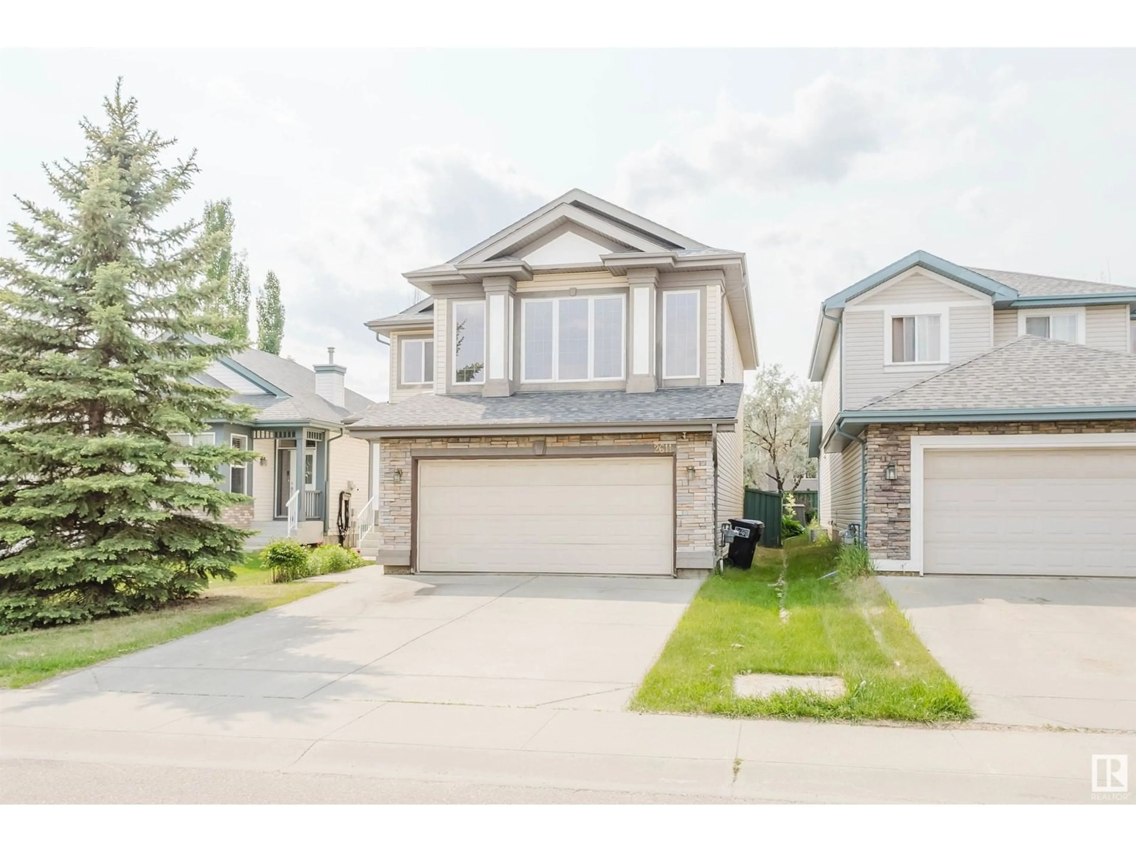 Home with vinyl exterior material, street for 2611 HANNA CR, Edmonton Alberta T6R3C9