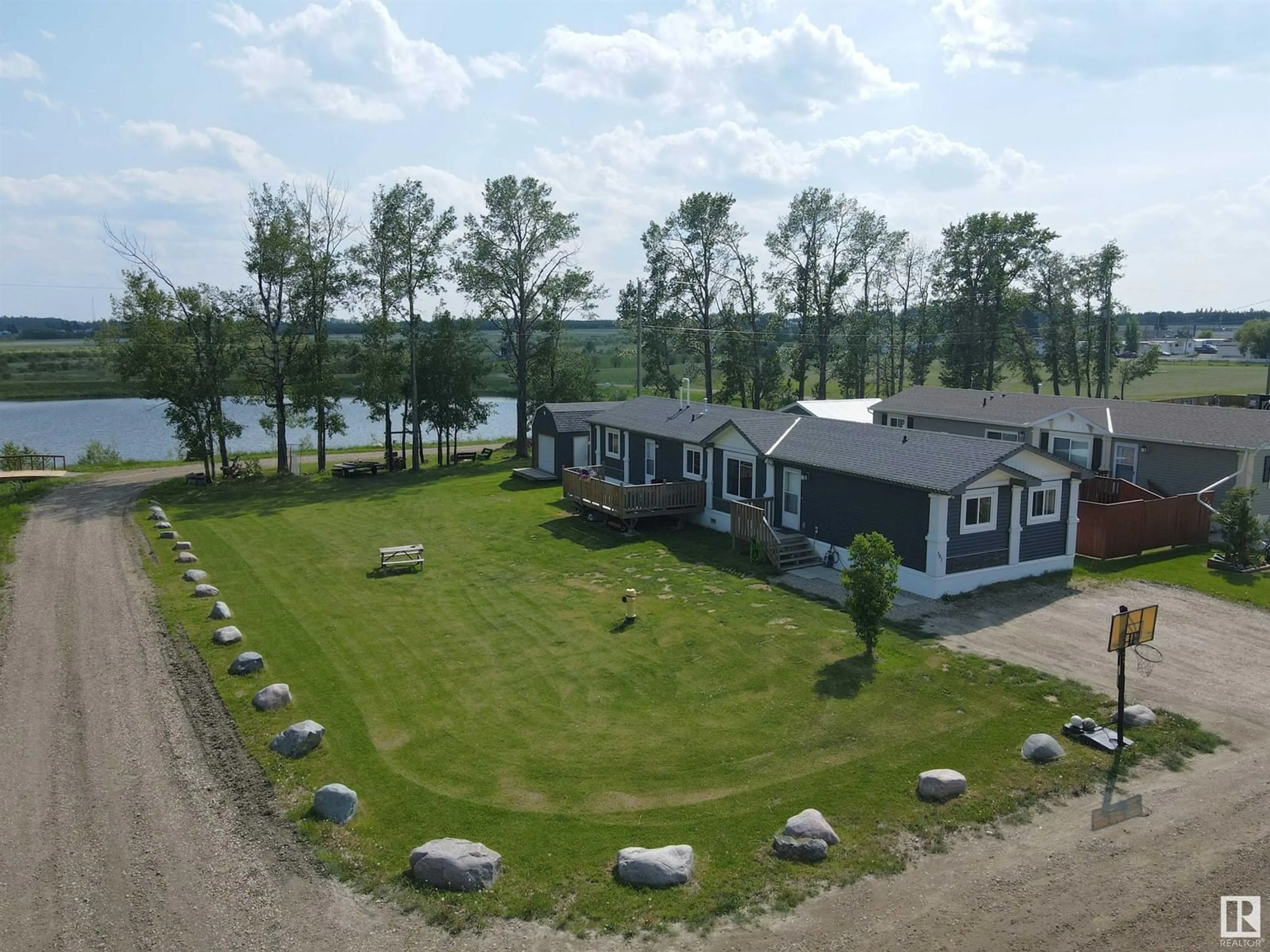 A pic from outside/outdoor area/front of a property/back of a property/a pic from drone, water/lake/river/ocean view for 49301 - 381 RANGE ROAD 80, Rural Brazeau County Alberta T7A1L7