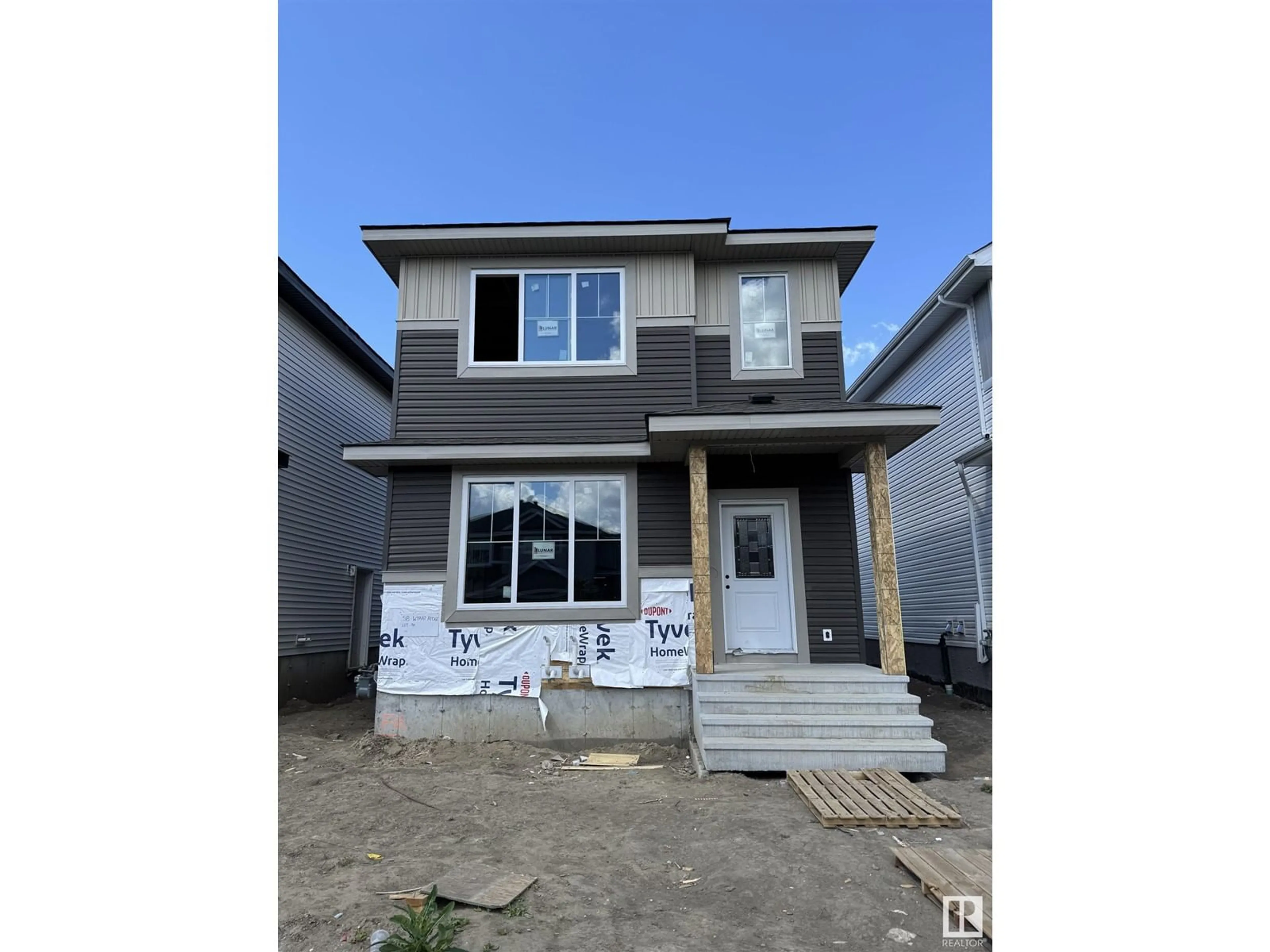 Home with vinyl exterior material, street for 58 WYATT RG, Fort Saskatchewan Alberta T8L0Y2