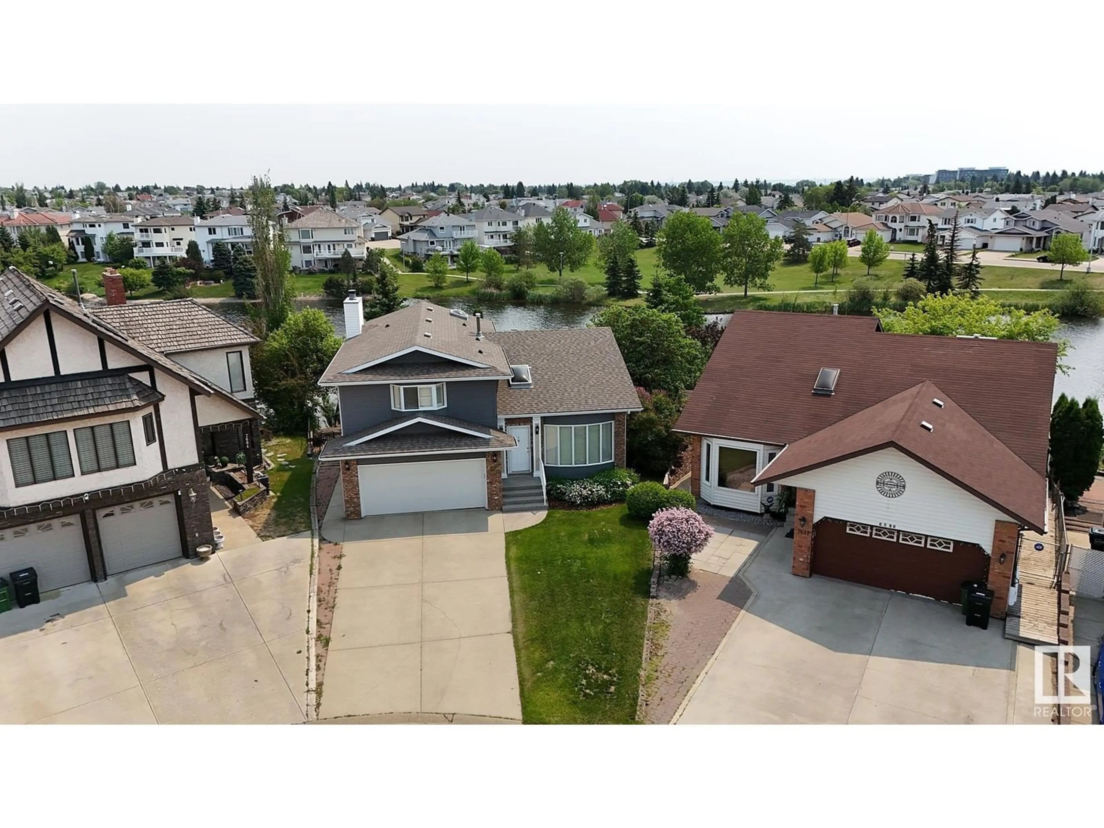 A pic from outside/outdoor area/front of a property/back of a property/a pic from drone, street for 7603 157 AV, Edmonton Alberta T5Z2S2
