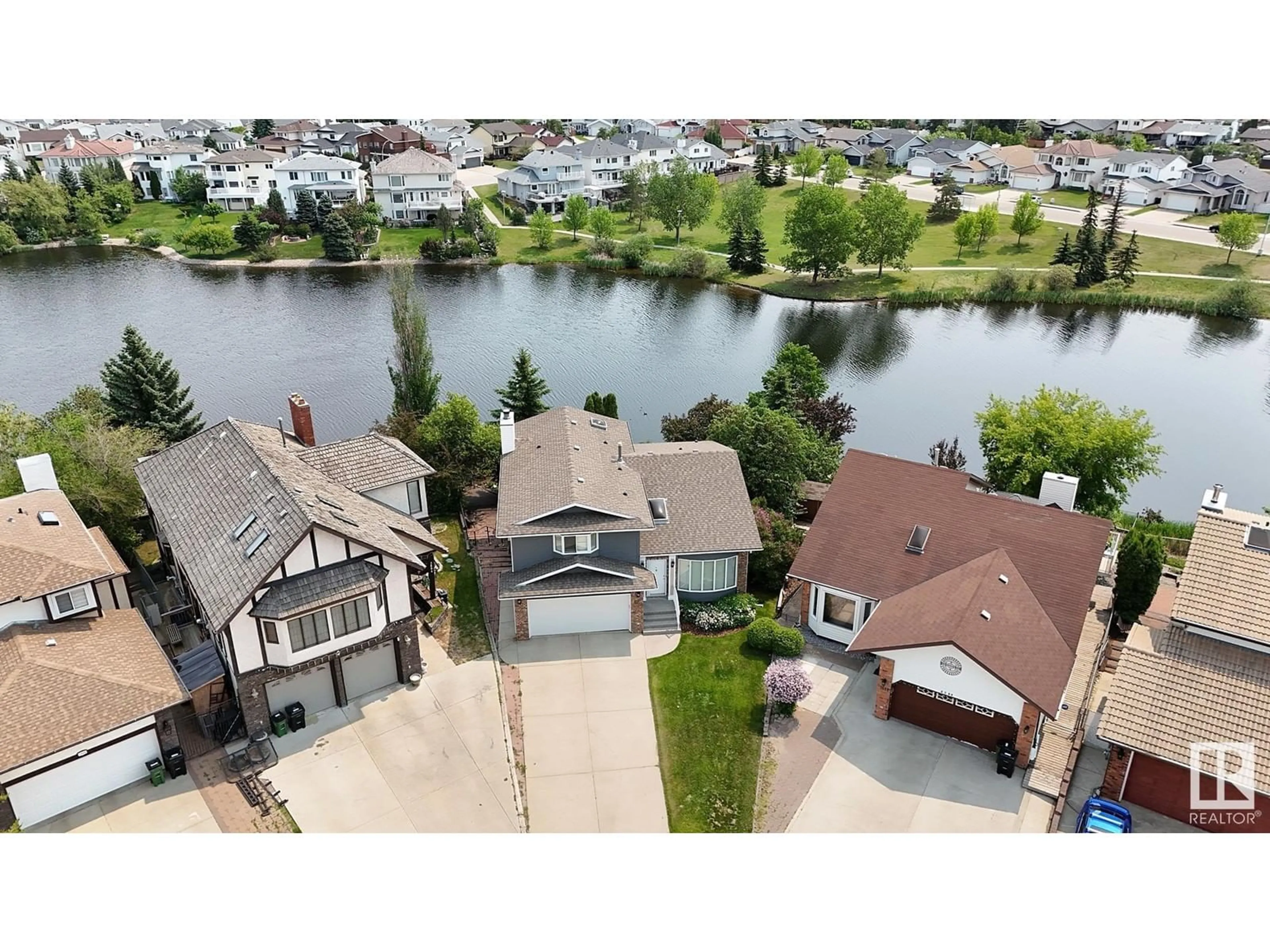 A pic from outside/outdoor area/front of a property/back of a property/a pic from drone, water/lake/river/ocean view for 7603 157 AV, Edmonton Alberta T5Z2S2