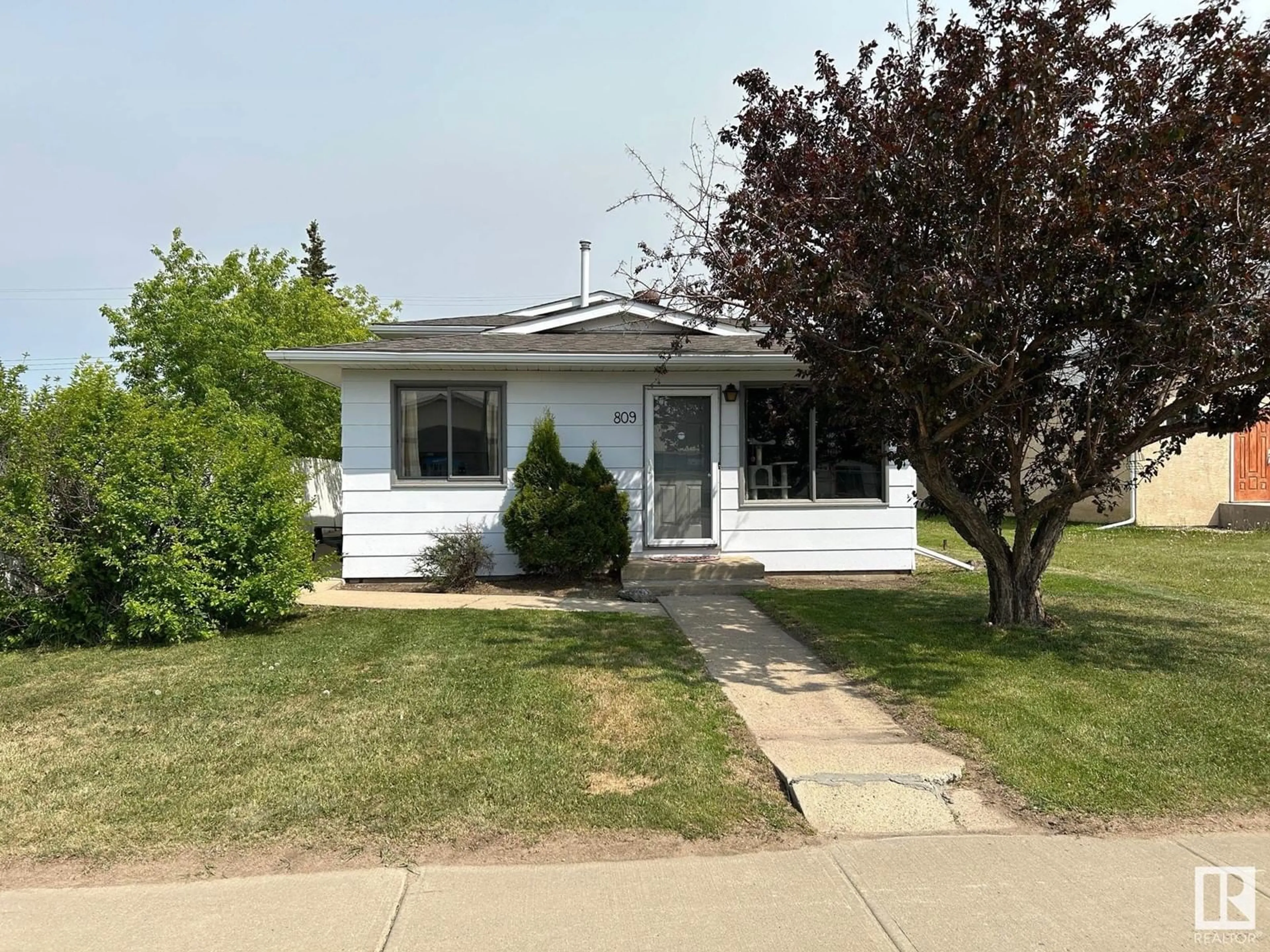 Home with vinyl exterior material, street for 809 2 ST, Thorhild Alberta T0A3J0