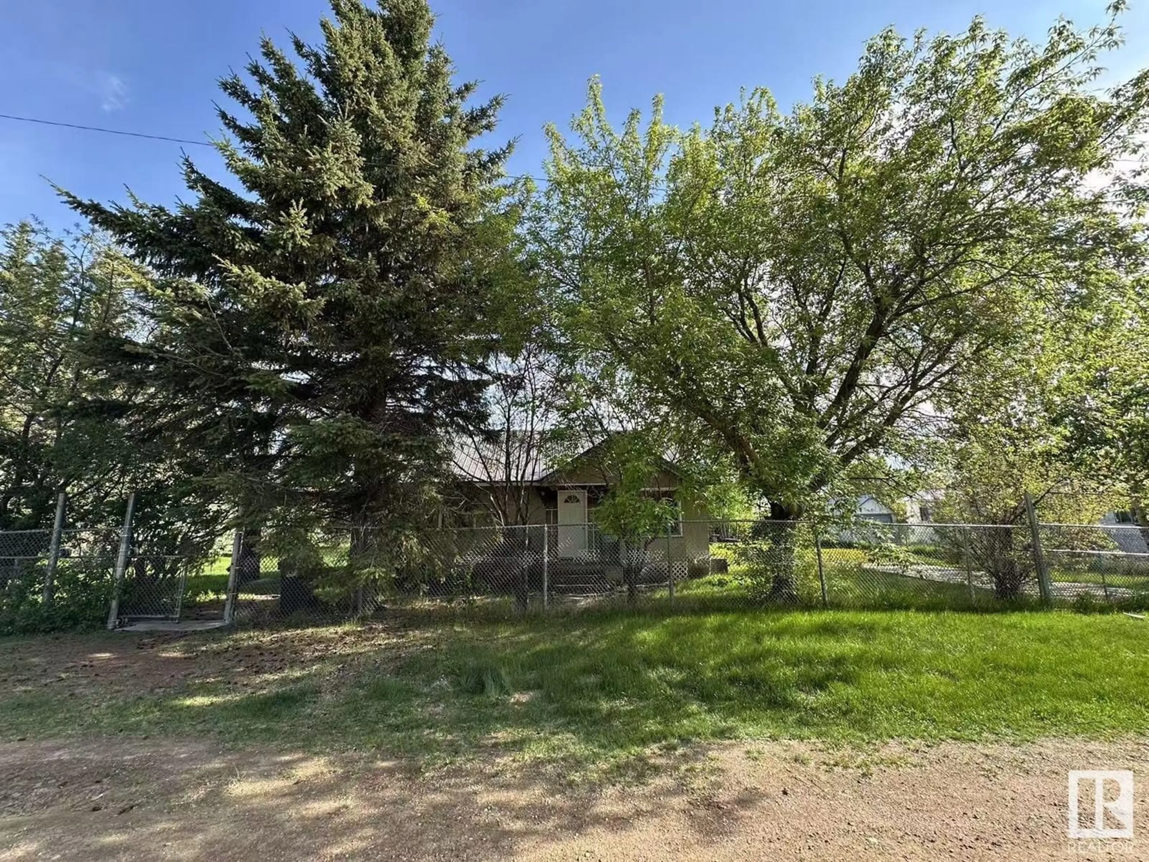 A pic from outside/outdoor area/front of a property/back of a property/a pic from drone, forest/trees view for 5013 49 AV, Egremont Alberta T0A0Z0