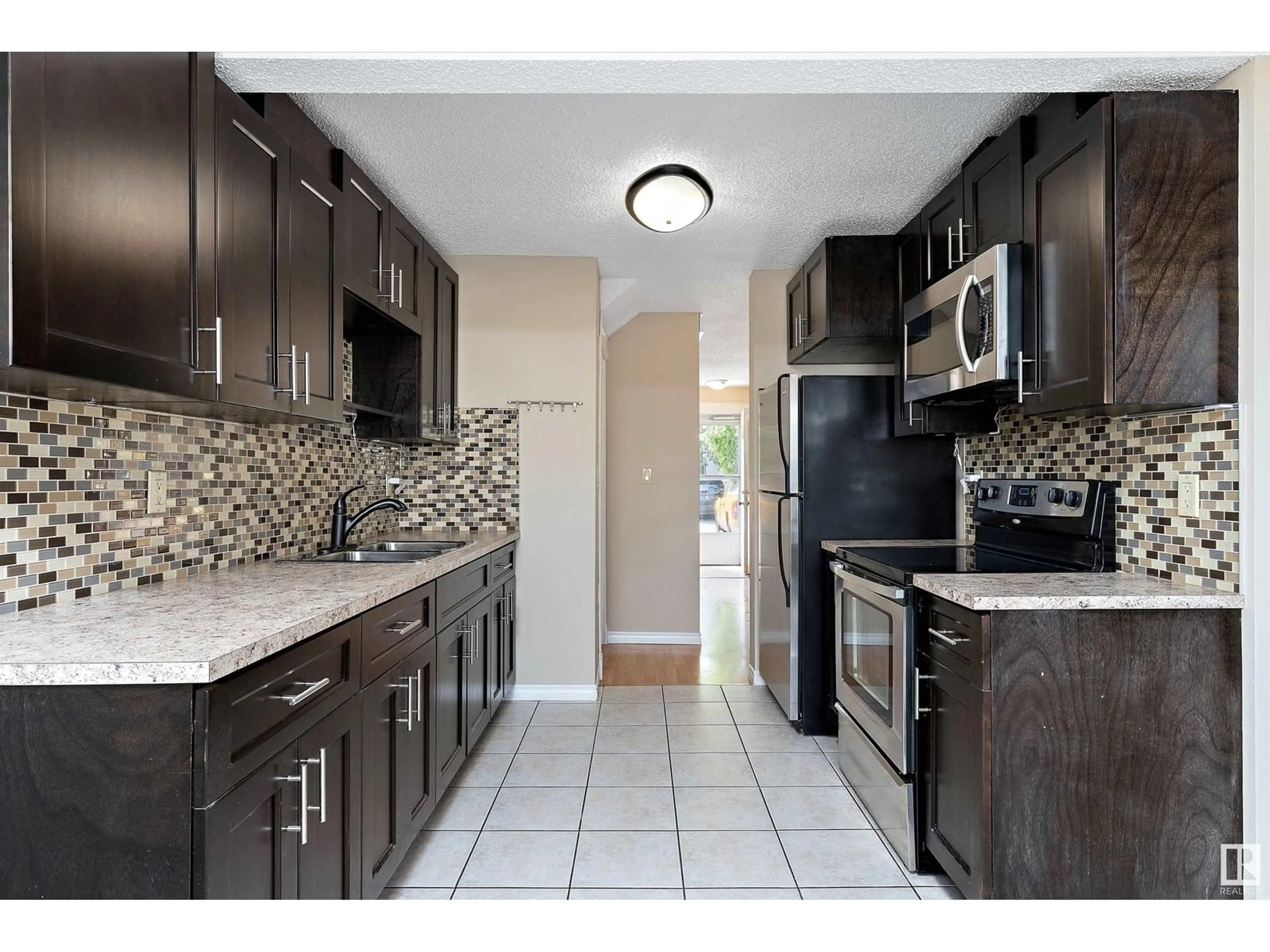Standard kitchen, ceramic/tile floor for NW - 14795 25 ST, Edmonton Alberta T5Y2E8