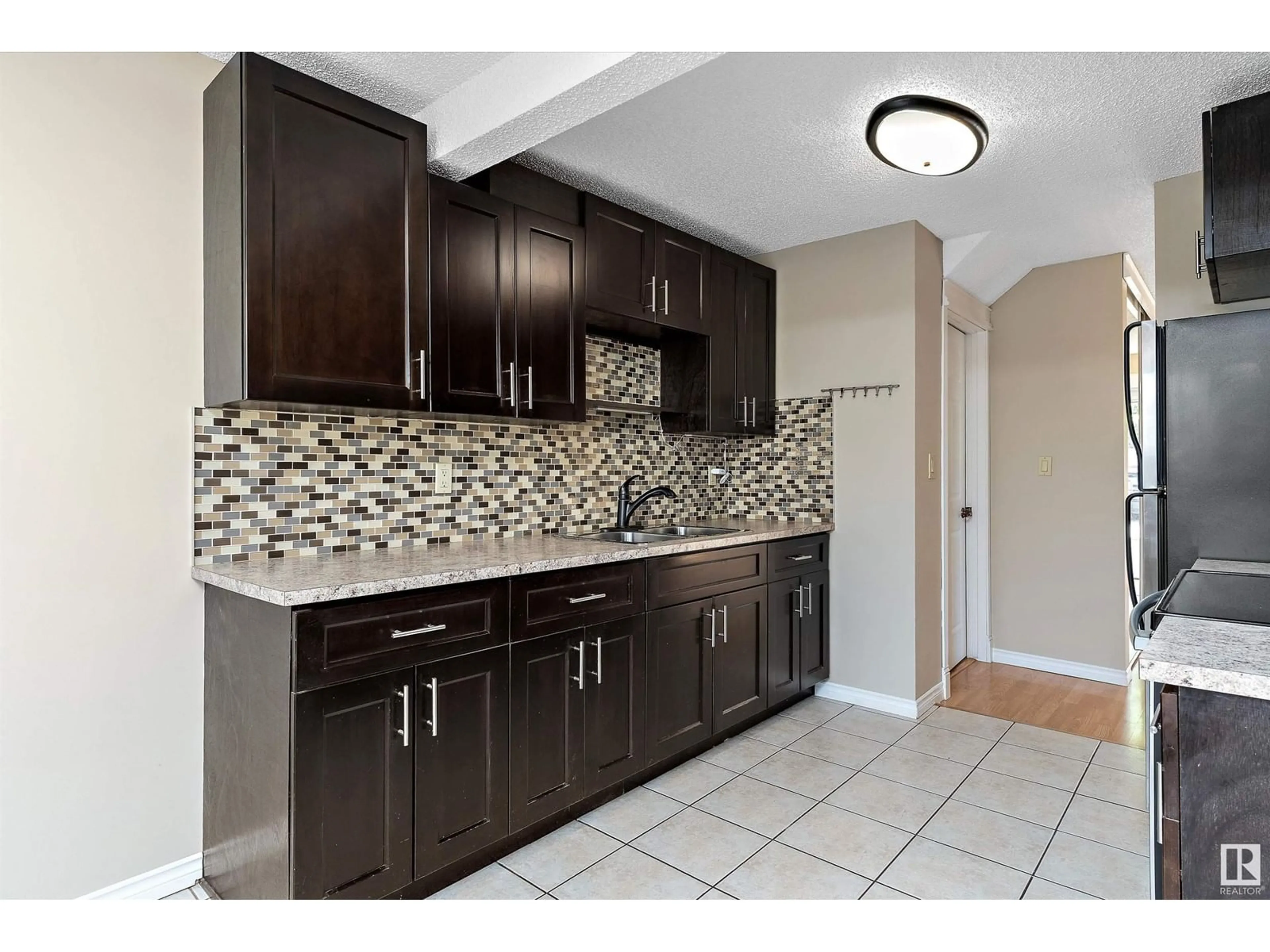 Standard kitchen, ceramic/tile floor for NW - 14795 25 ST, Edmonton Alberta T5Y2E8